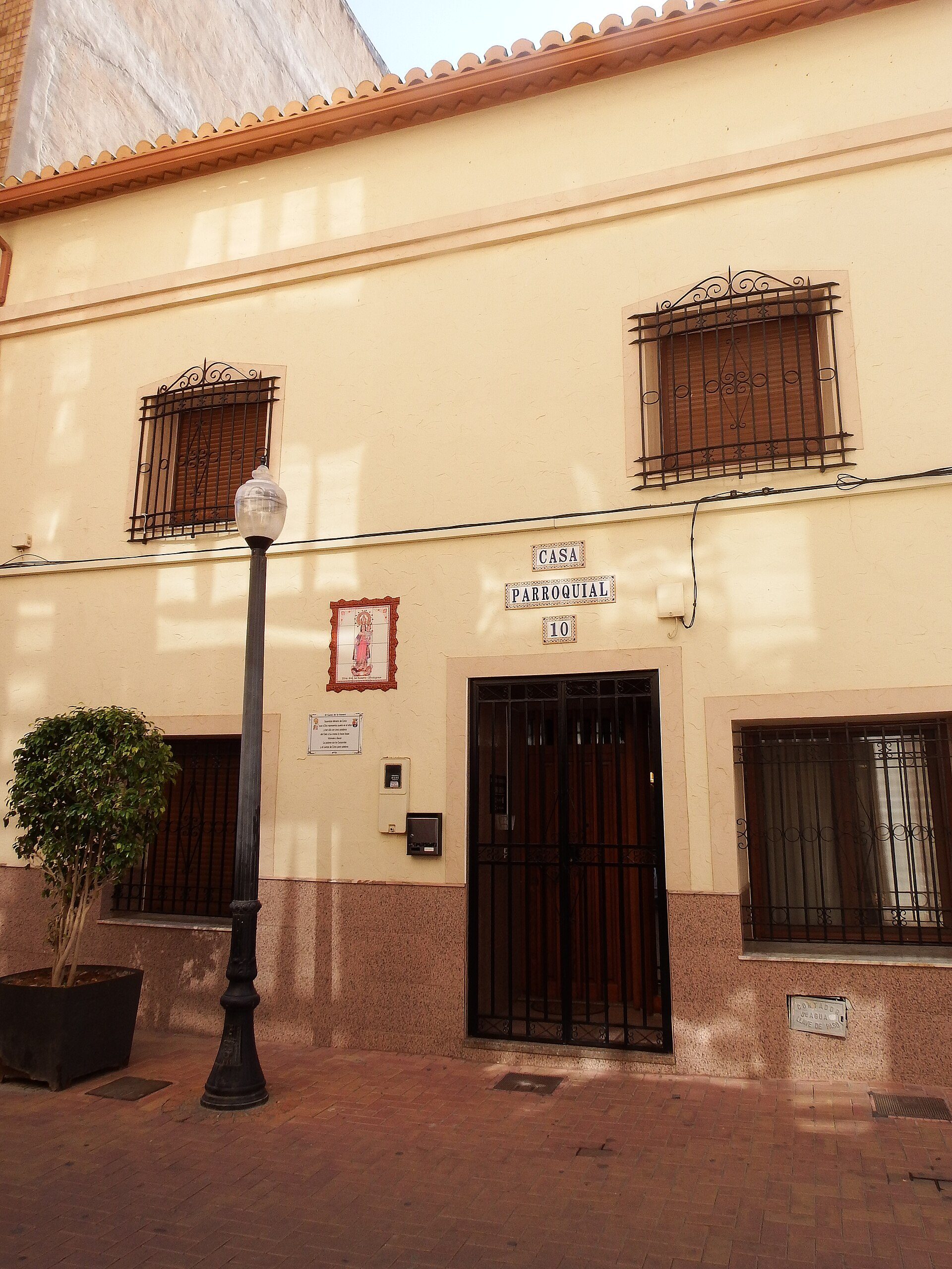 A cozy apartment with a courtyard view, featuring a balcony, modern decor, and a small garden.