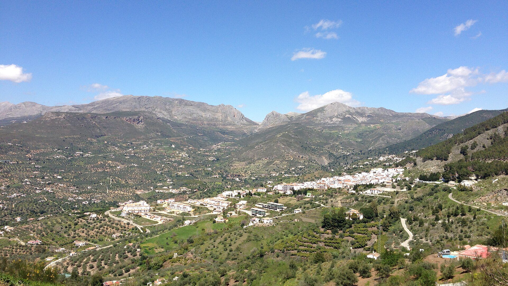 Alt text: Spacious room with mountain view, balcony, and modern amenities.