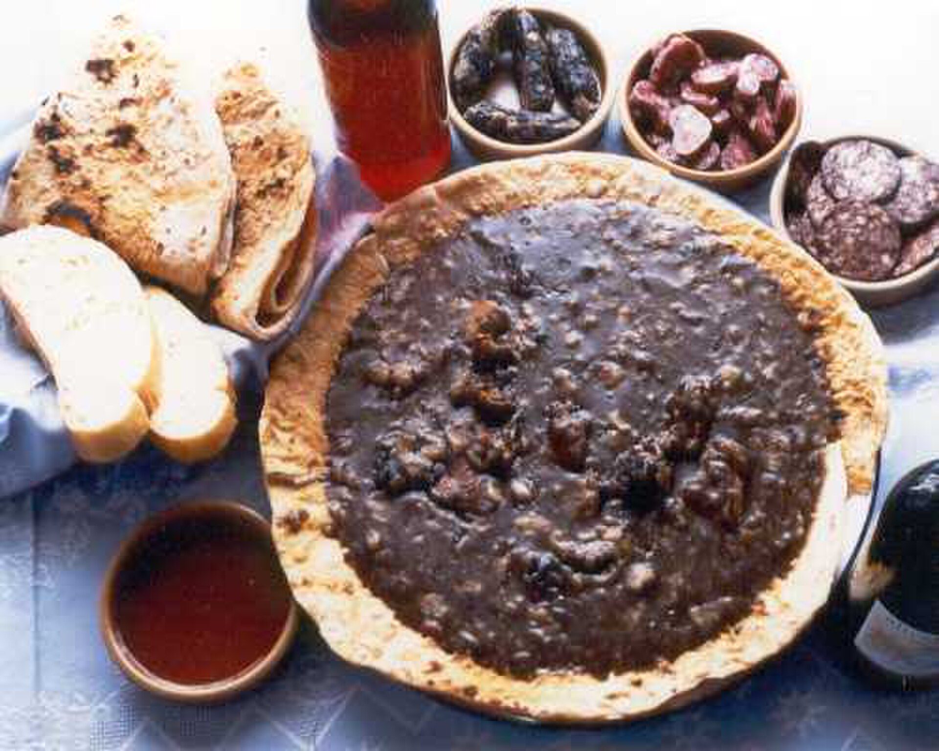 Alt text: A cozy room with a large window offering a scenic view of a mountain landscape.