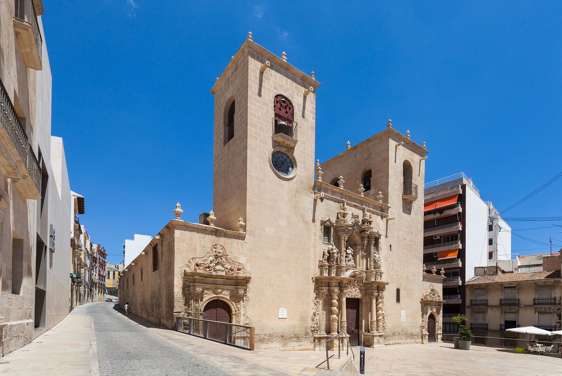 Alt text: Historic church with ornate facade, bell tower, and clear blue sky view.