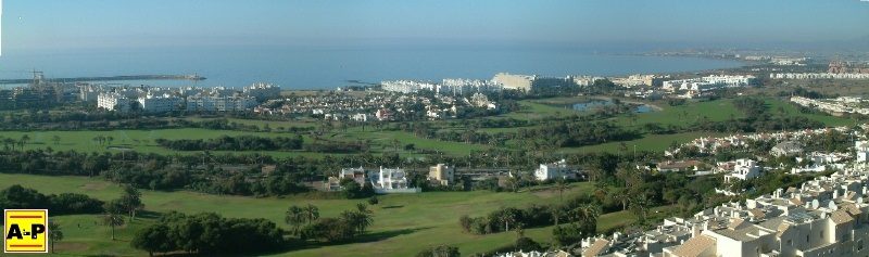 Showing the green village of Almerimar next to the Mediterranean.