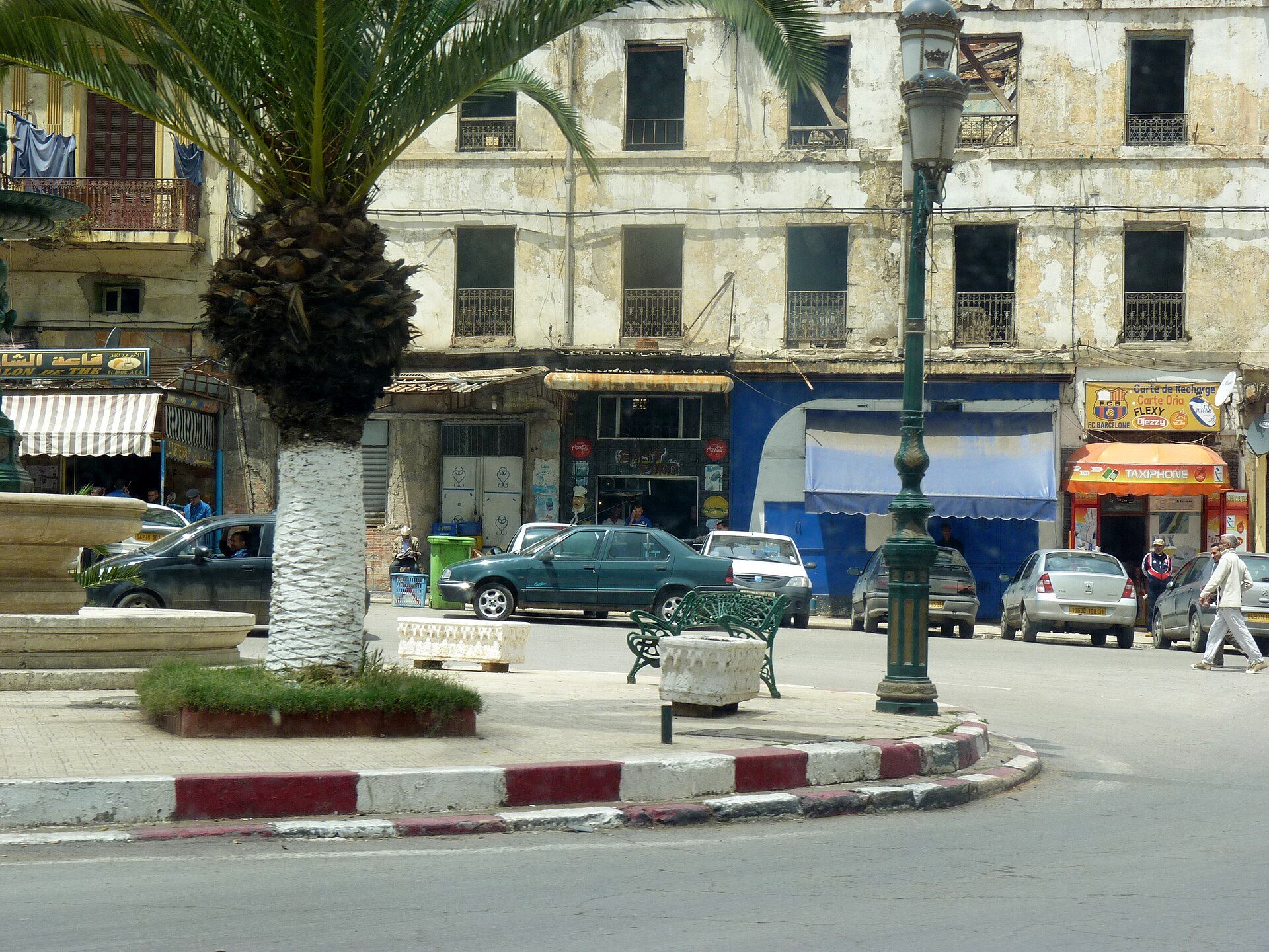 Alt text: "Cozy room with city view, featuring a balcony and modern decor.
