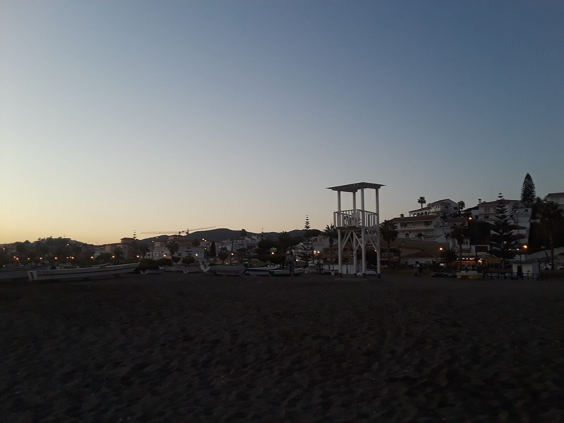 Beachfront room with ocean view, balcony, and modern amenities.