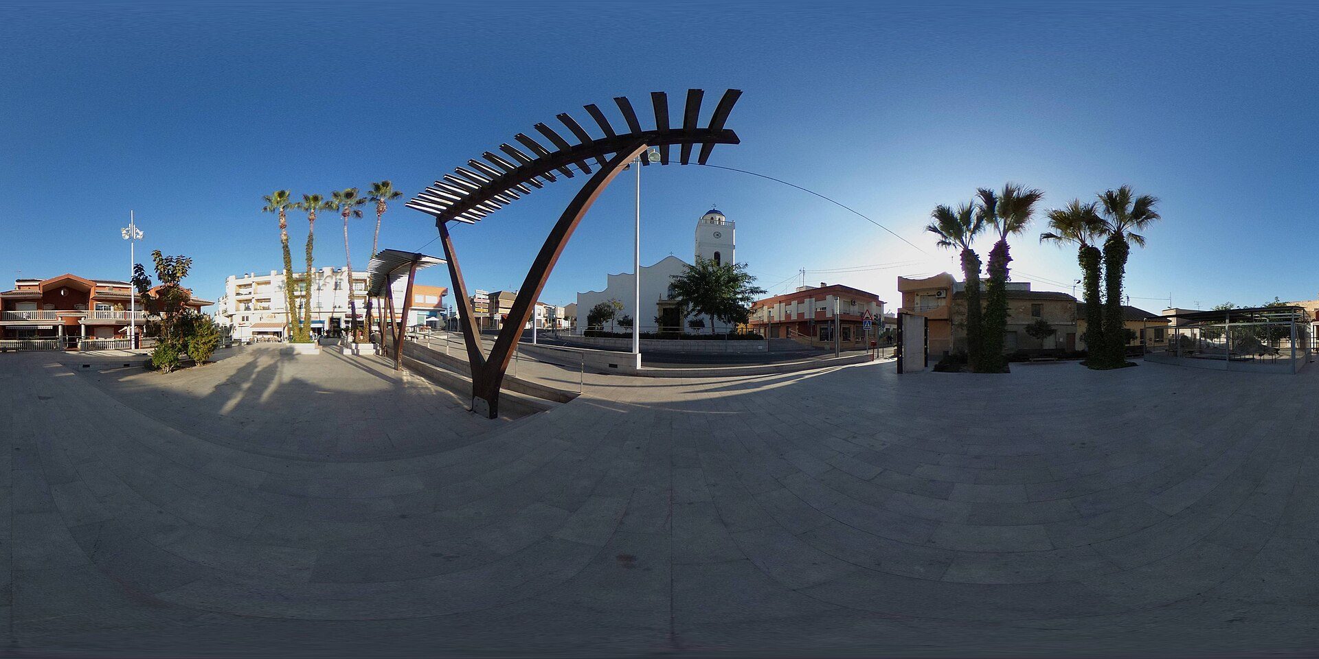Alt text: Modern room with city view, featuring large windows and a balcony.