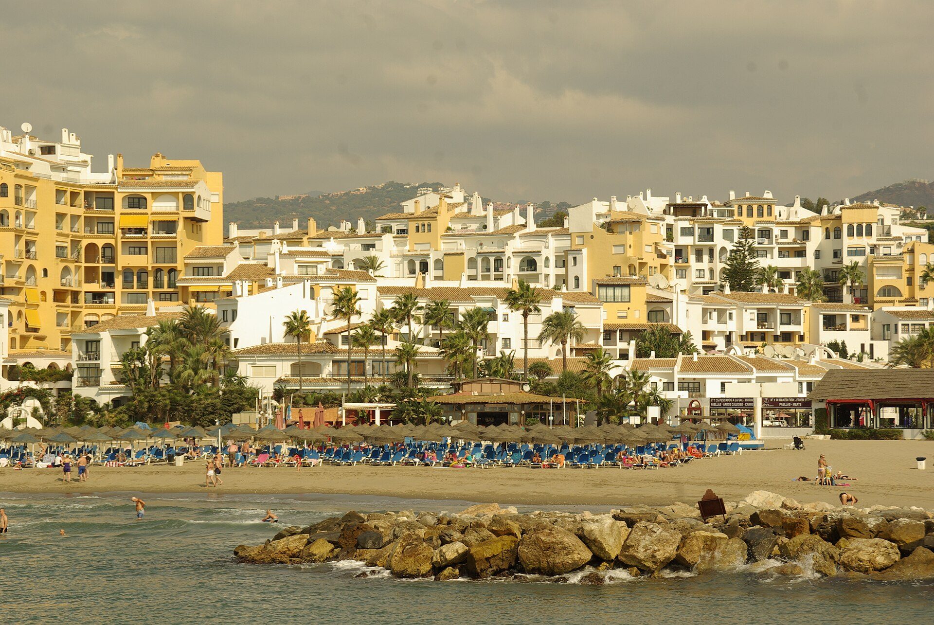 Spacious beachfront apartment with ocean view, balcony, and modern amenities.