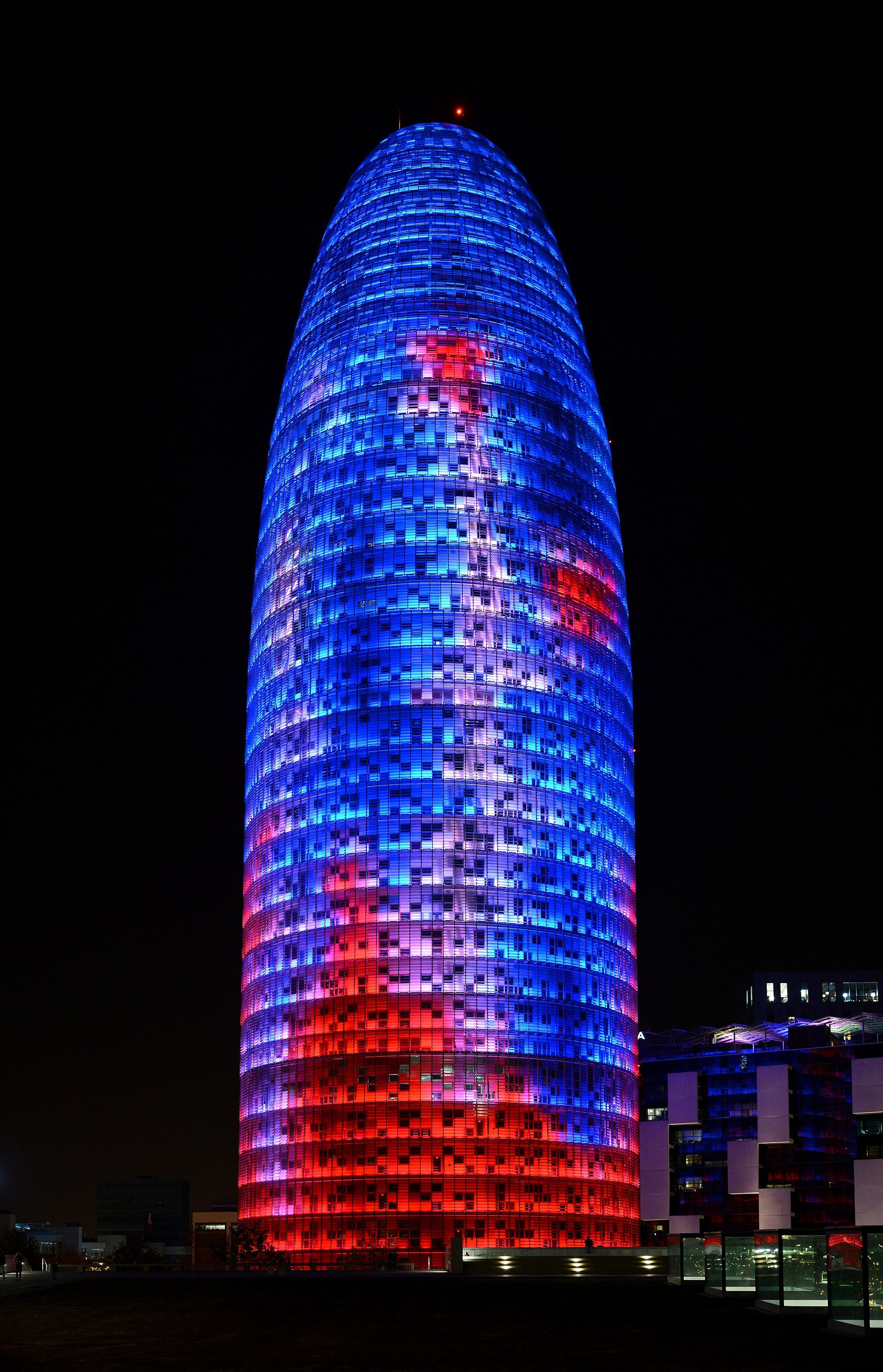 The Glòries Tower (Torre Glòries) at night, in Barcelona, Spain
