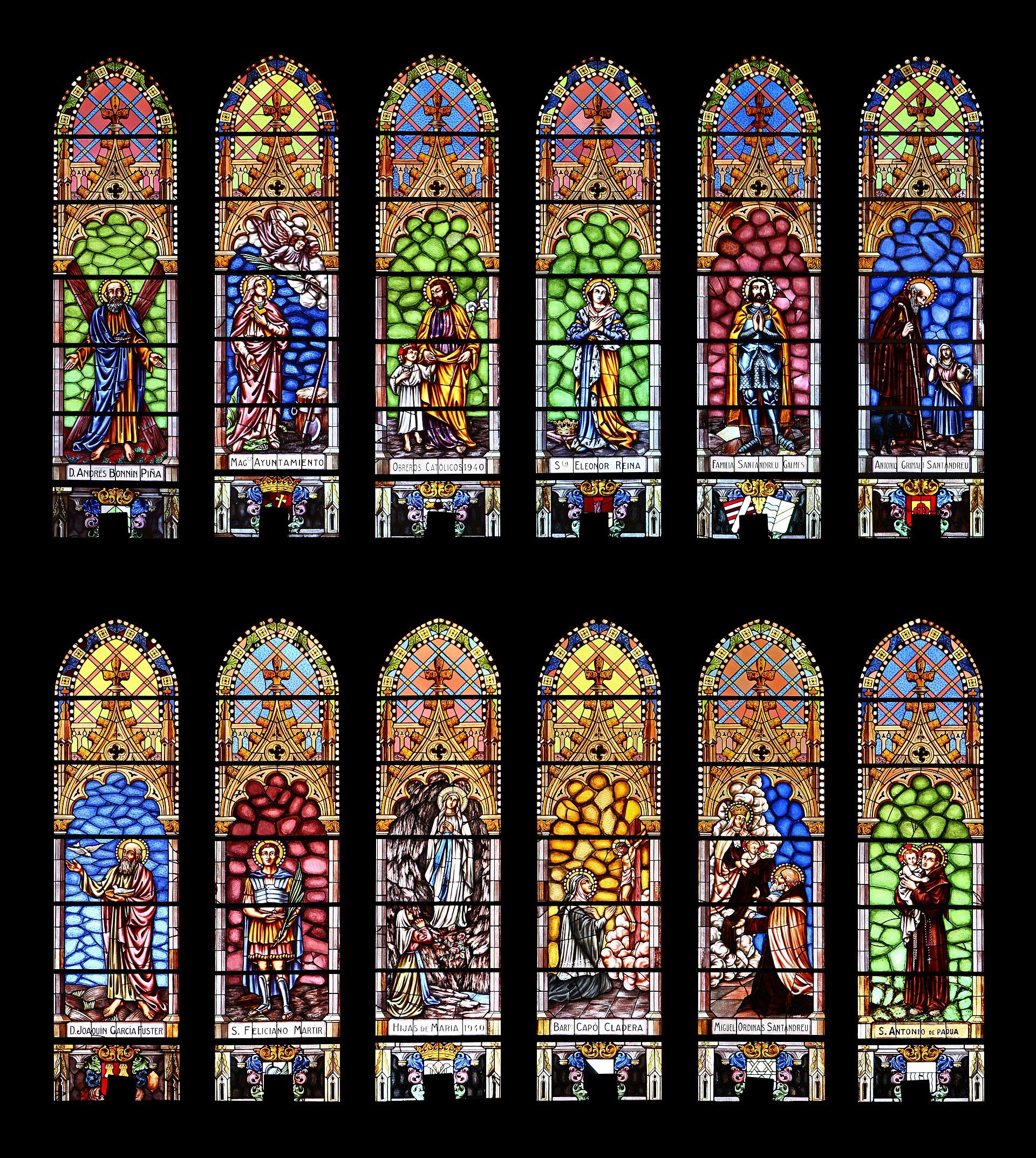 A set of colorful stained glass windows depicting religious scenes.