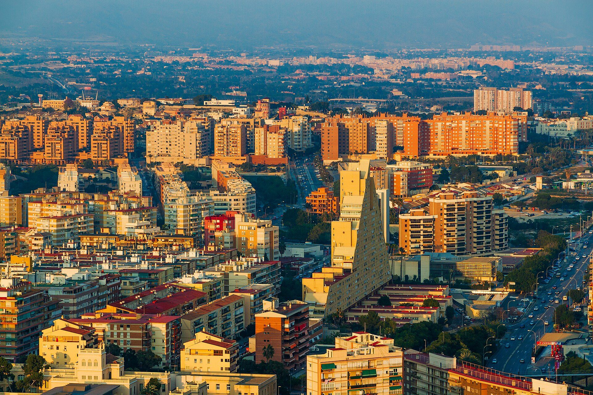 Alt text: Spacious apartment with city view, modern amenities, and large windows.