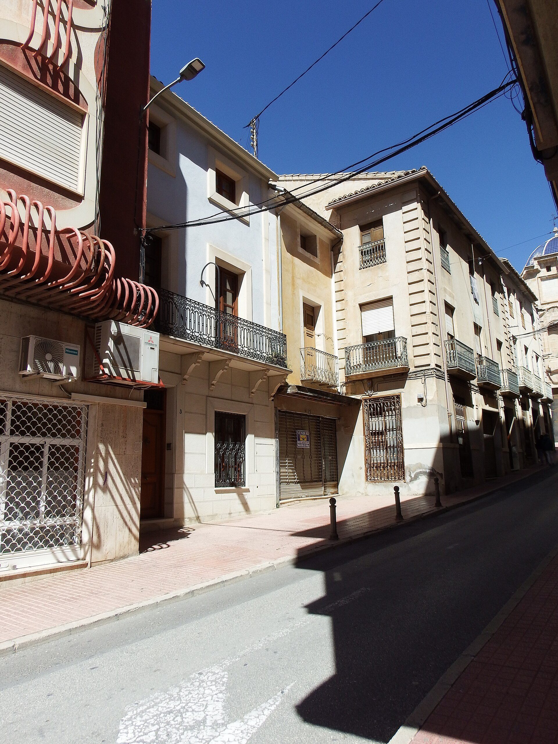 Two-story apartment with balcony, city view, modern amenities.