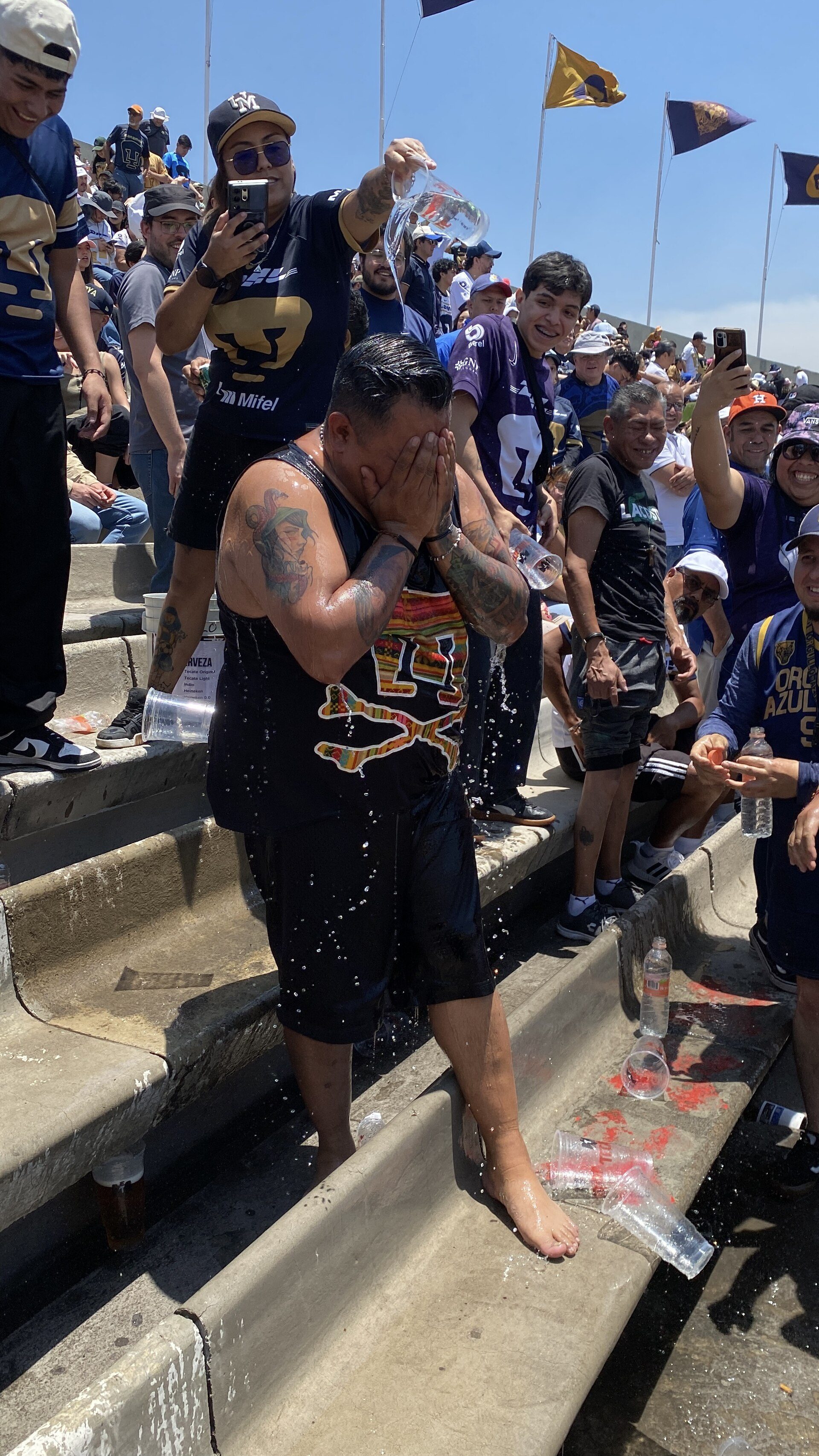 A member of the Rebel sports bar is dunked for his birthday. Images from the mat