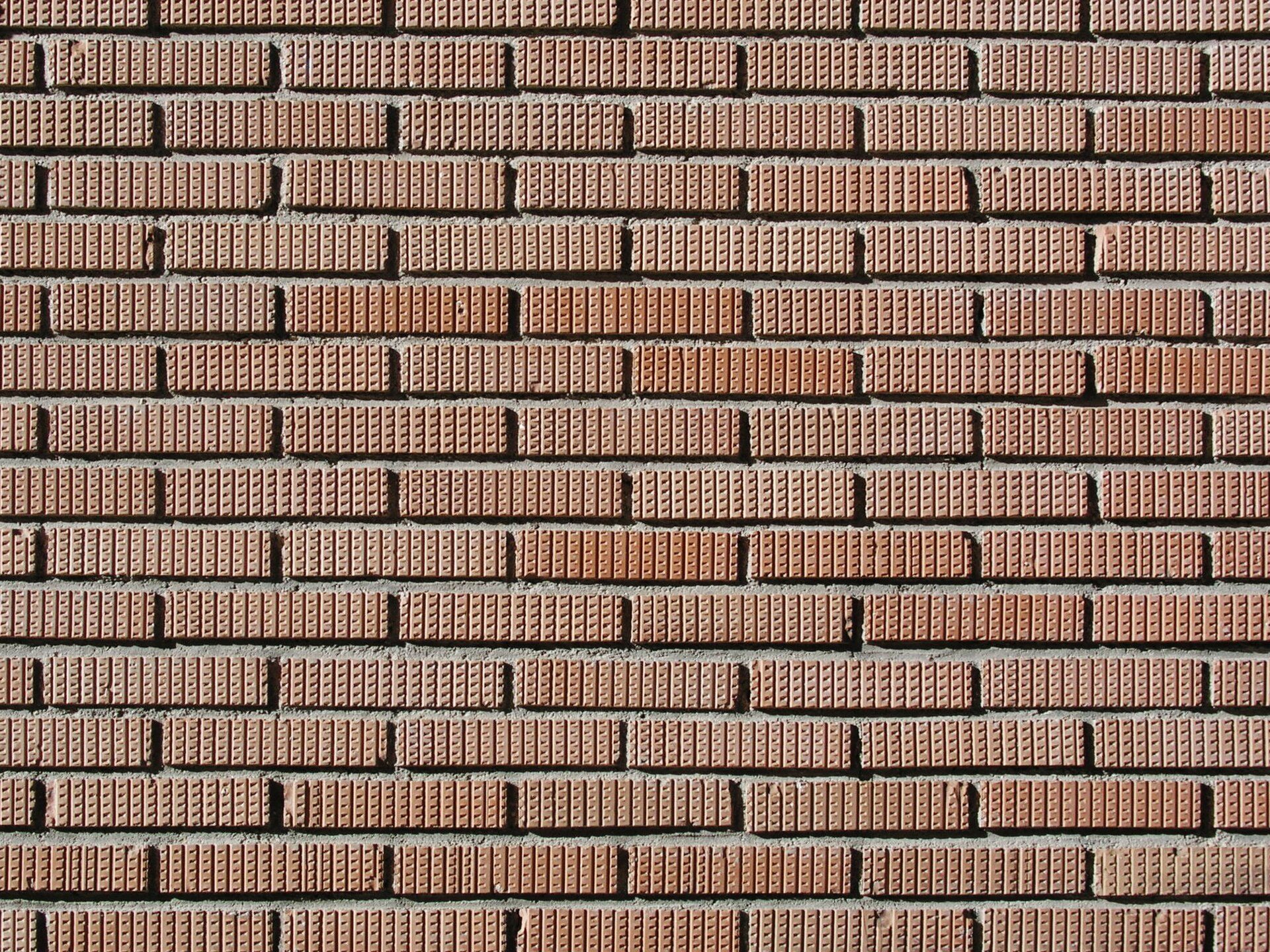 Red brick wall texture, no room type, view, or features visible.