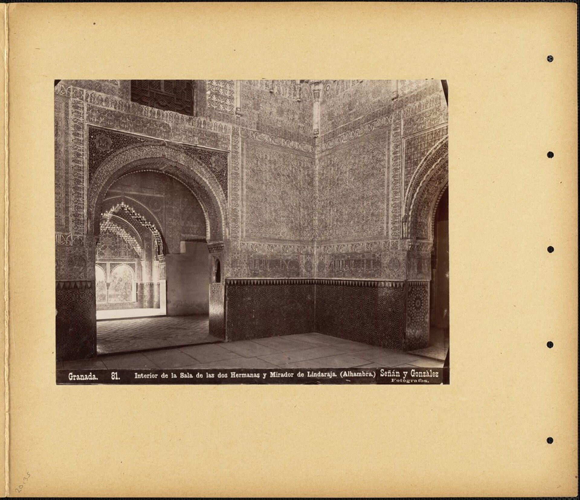 Interior of a historic mosque with intricate tile work and arched doorways.