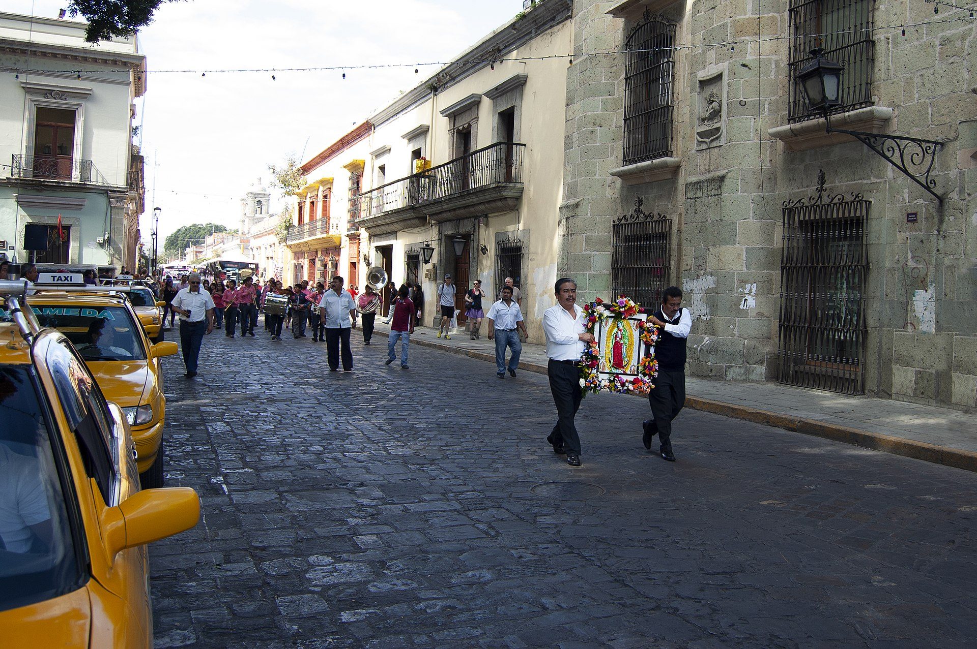 Alt text: Cozy room with city street view, featuring a balcony and modern decor.