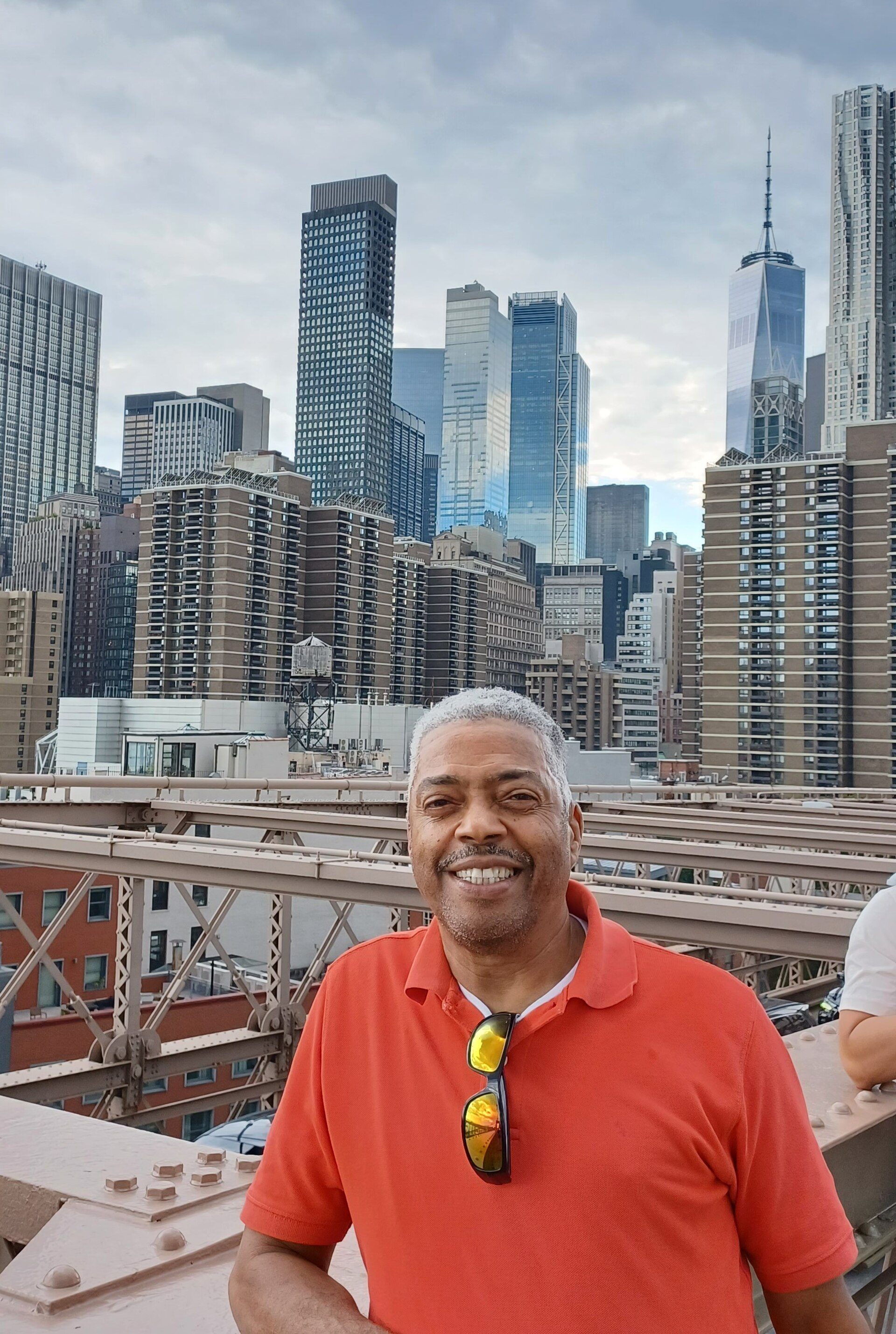 Room with city view, large windows, modern decor, balcony access.