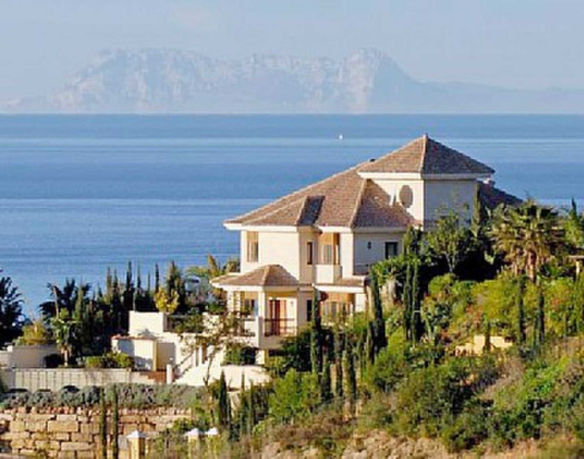 Luxury villa with sea view, featuring multiple terraces and a private pool.