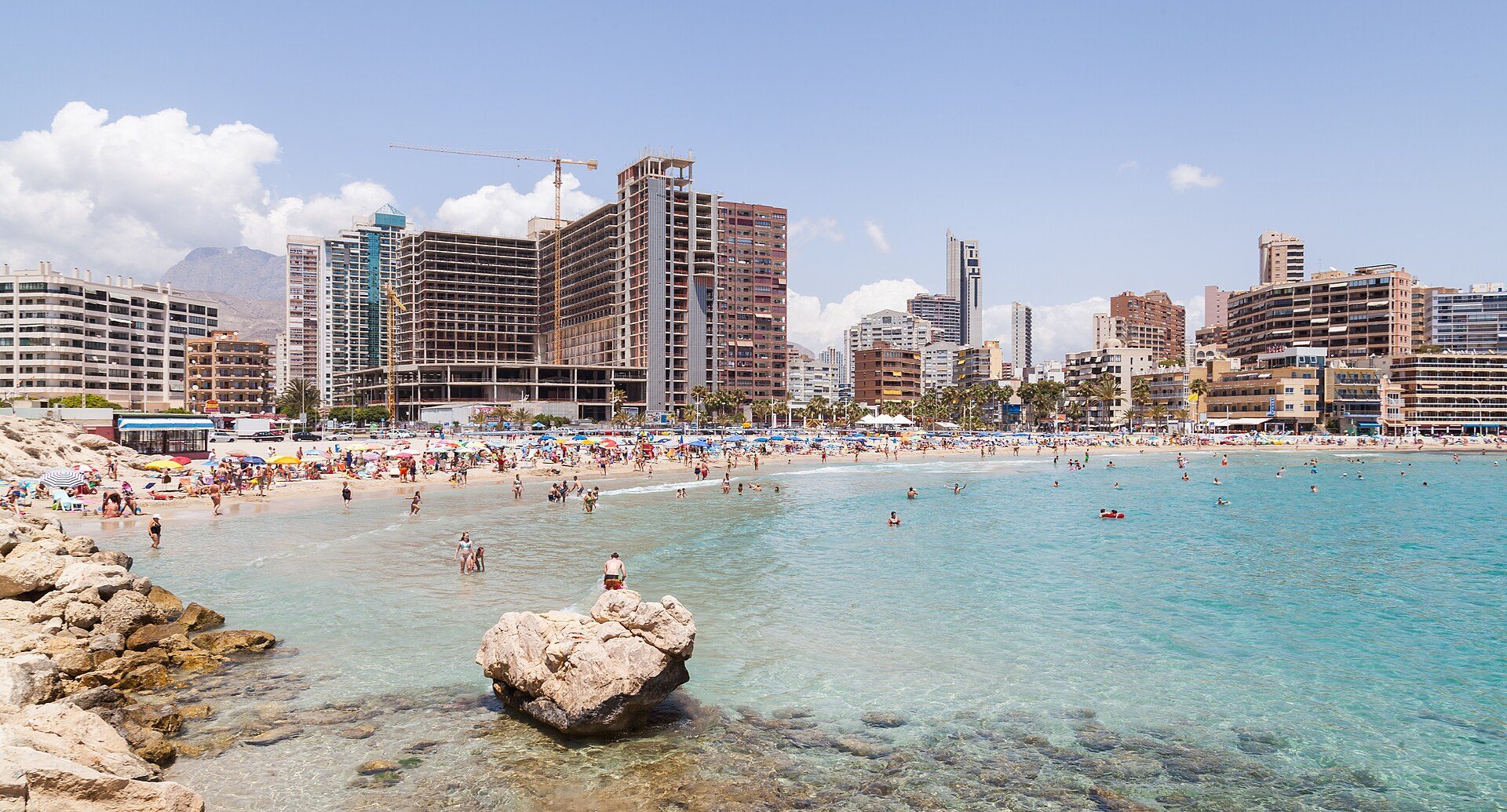 Beachfront apartment with city and sea views, balcony, modern amenities.