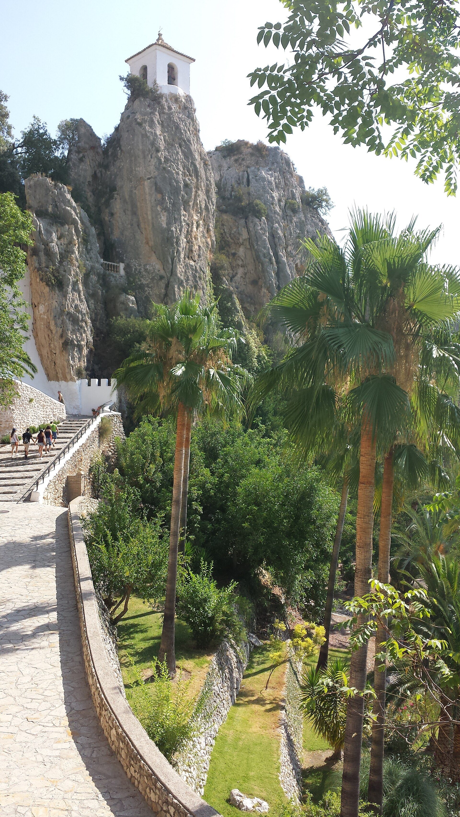 Alt text: "Luxurious villa with panoramic mountain view, featuring a private terrace and lush garden.