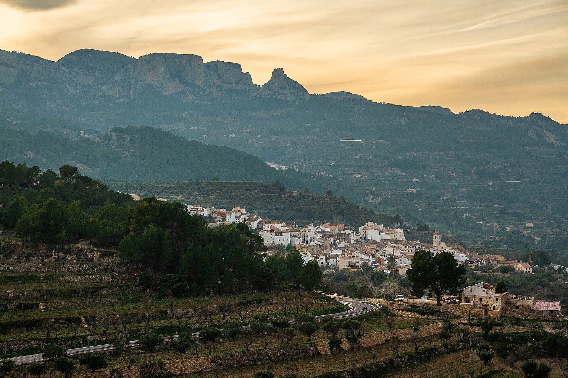 Cozy room with mountain view, featuring a balcony and comfortable seating.