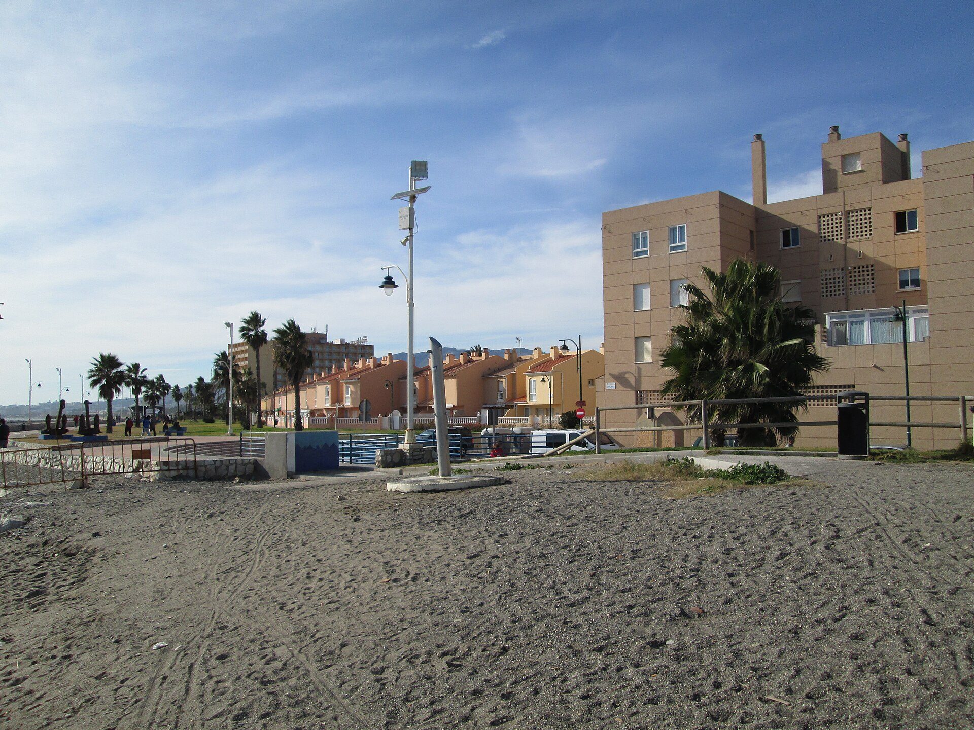 Beachfront apartment with balcony, sea view, modern amenities.