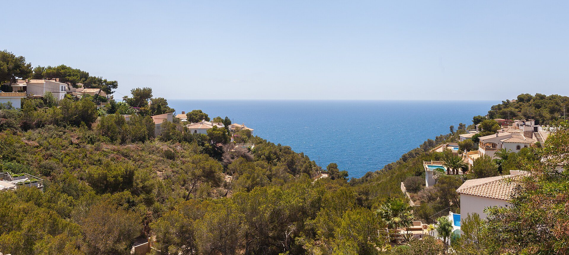 Cozy villa with private pool, stunning ocean view, surrounded by lush greenery.