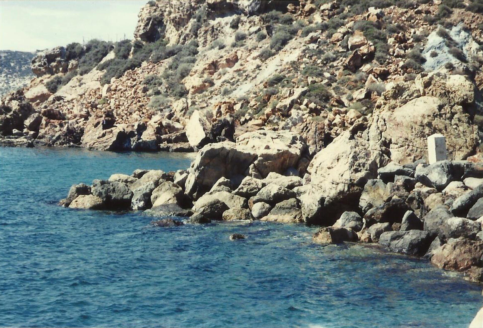 Cozy coastal room with ocean view, featuring large windows and a private balcony.