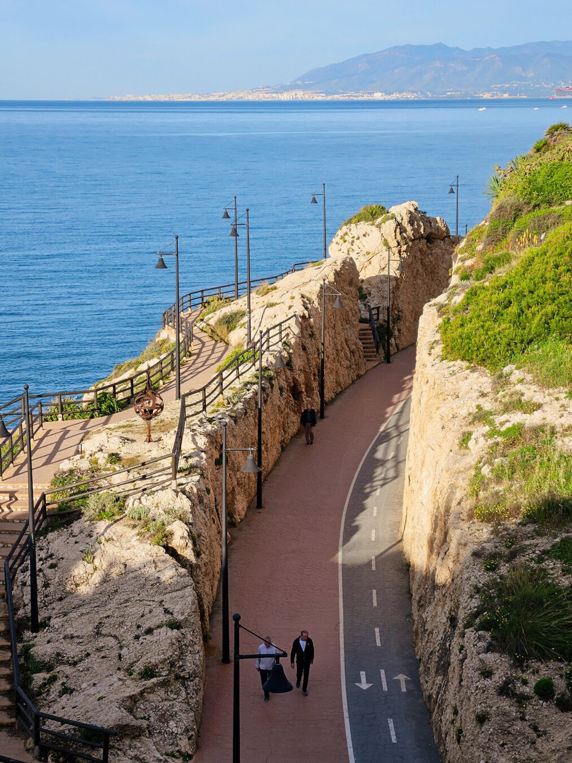 Cozy room with ocean view, balcony, and modern amenities.