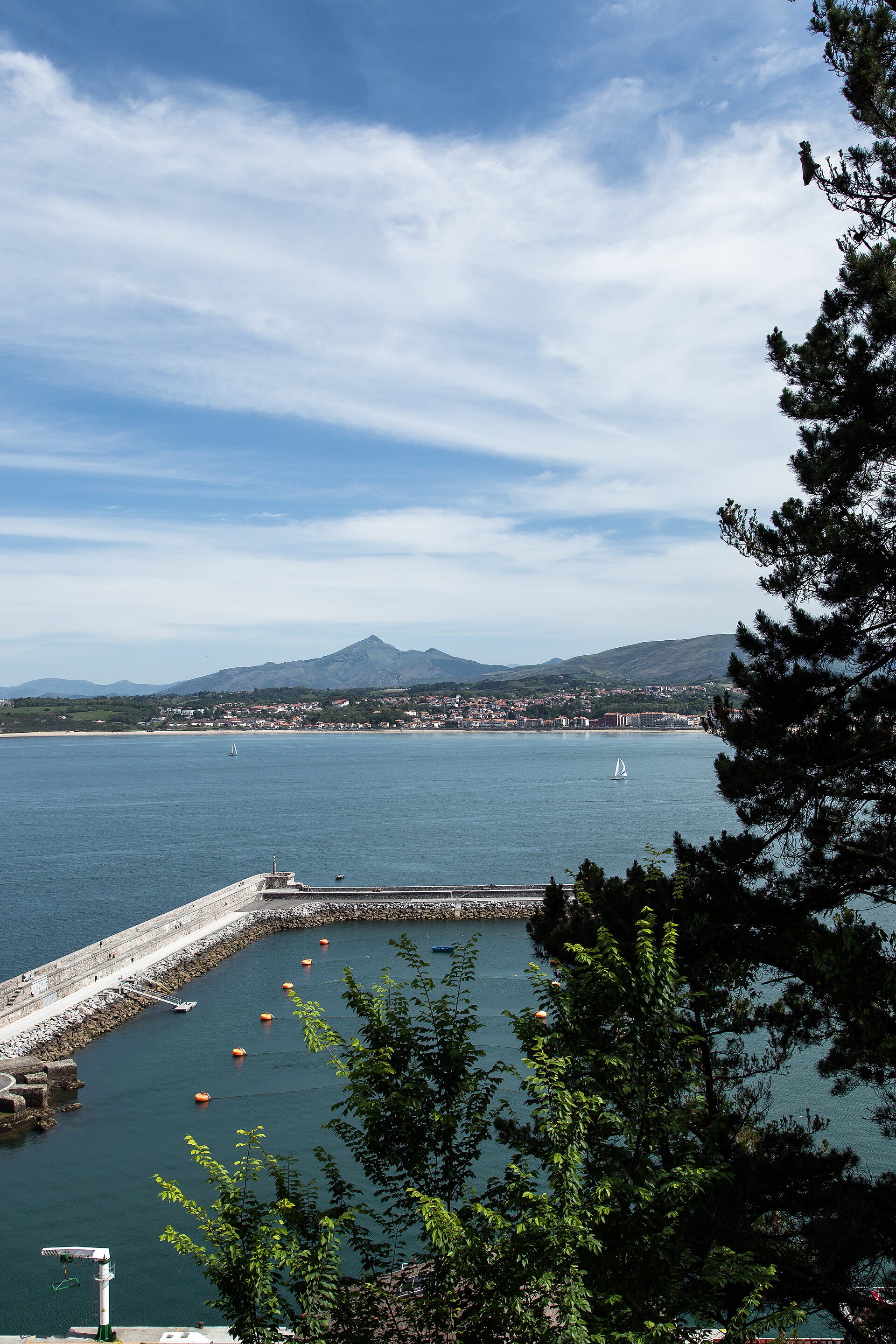 Alt text: Panoramic coastal view from a spacious room with a private balcony and sea access.