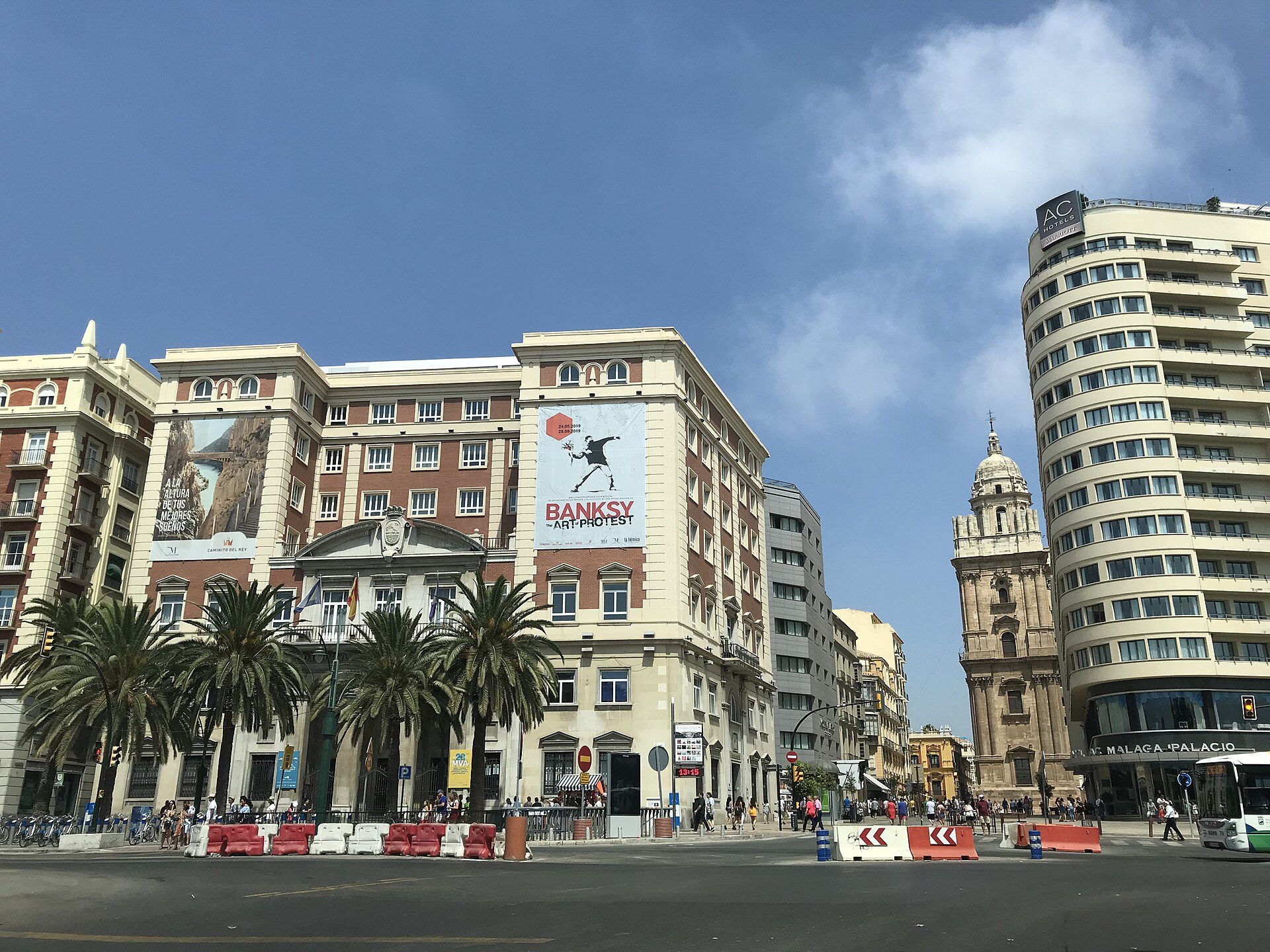 Spacious room with city view, modern amenities, balcony access.