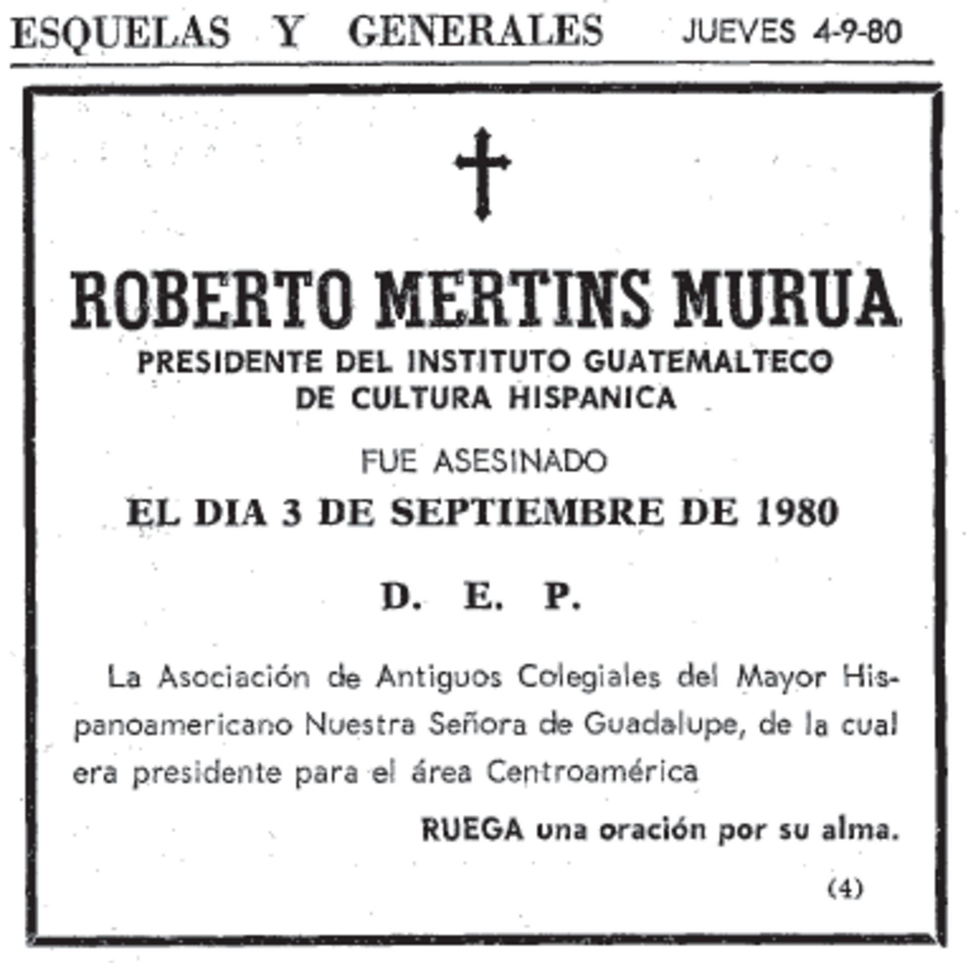 Alt text: Black and white photo of a memorial plaque for Roberto Martins Murua, featuring a cross and text in Spanish.