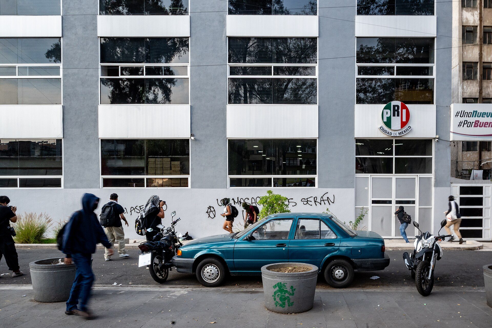 Alt text: Modern apartment with city view, featuring large windows and a balcony.