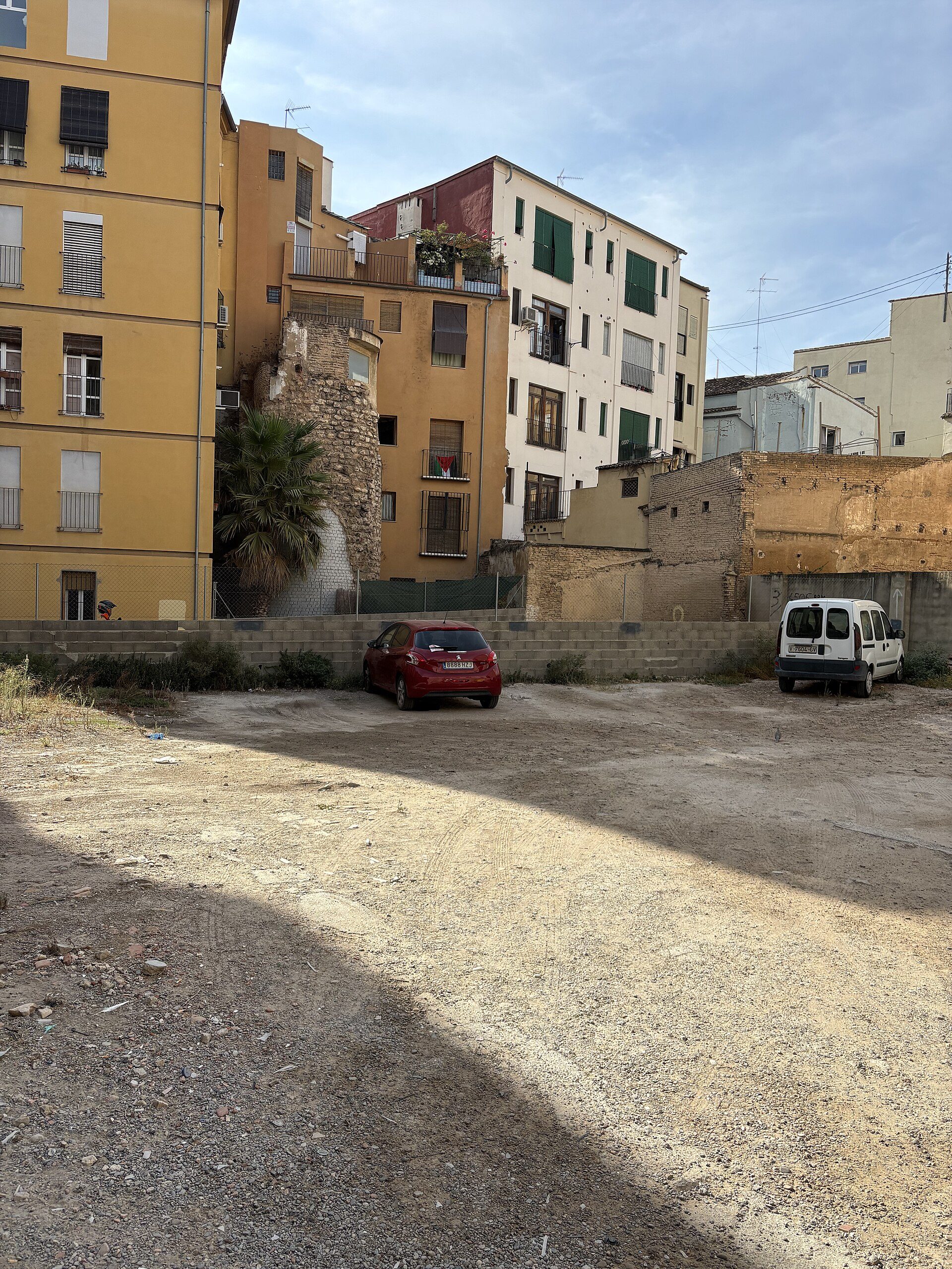 A small apartment with a city view, featuring a balcony and modern decor.