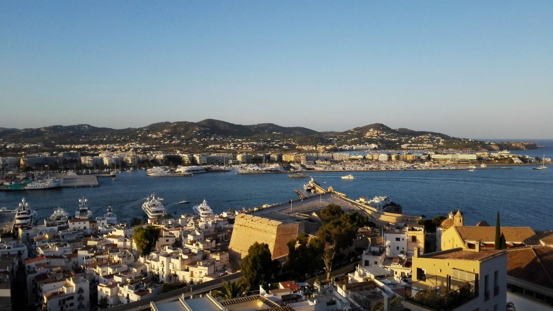 Alt text: Spacious room with panoramic sea view, featuring a balcony and modern amenities.