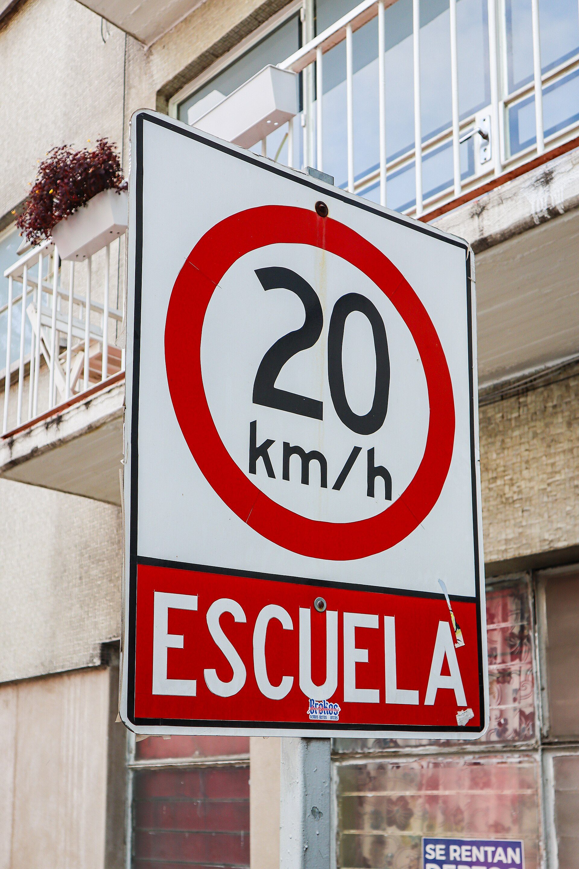 Alt text: "Spacious room with balcony, city view, modern furniture, and large windows.