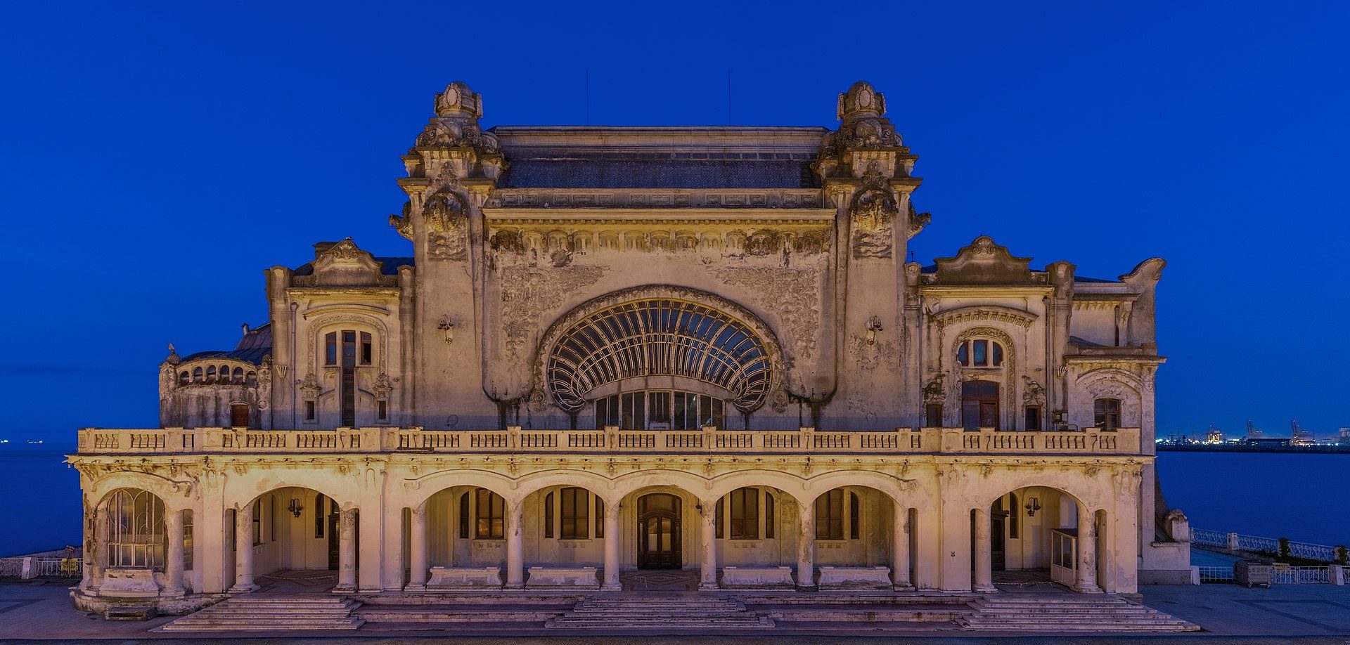 Blue hour view of the Constanța Casino, a casino located directly in front of th