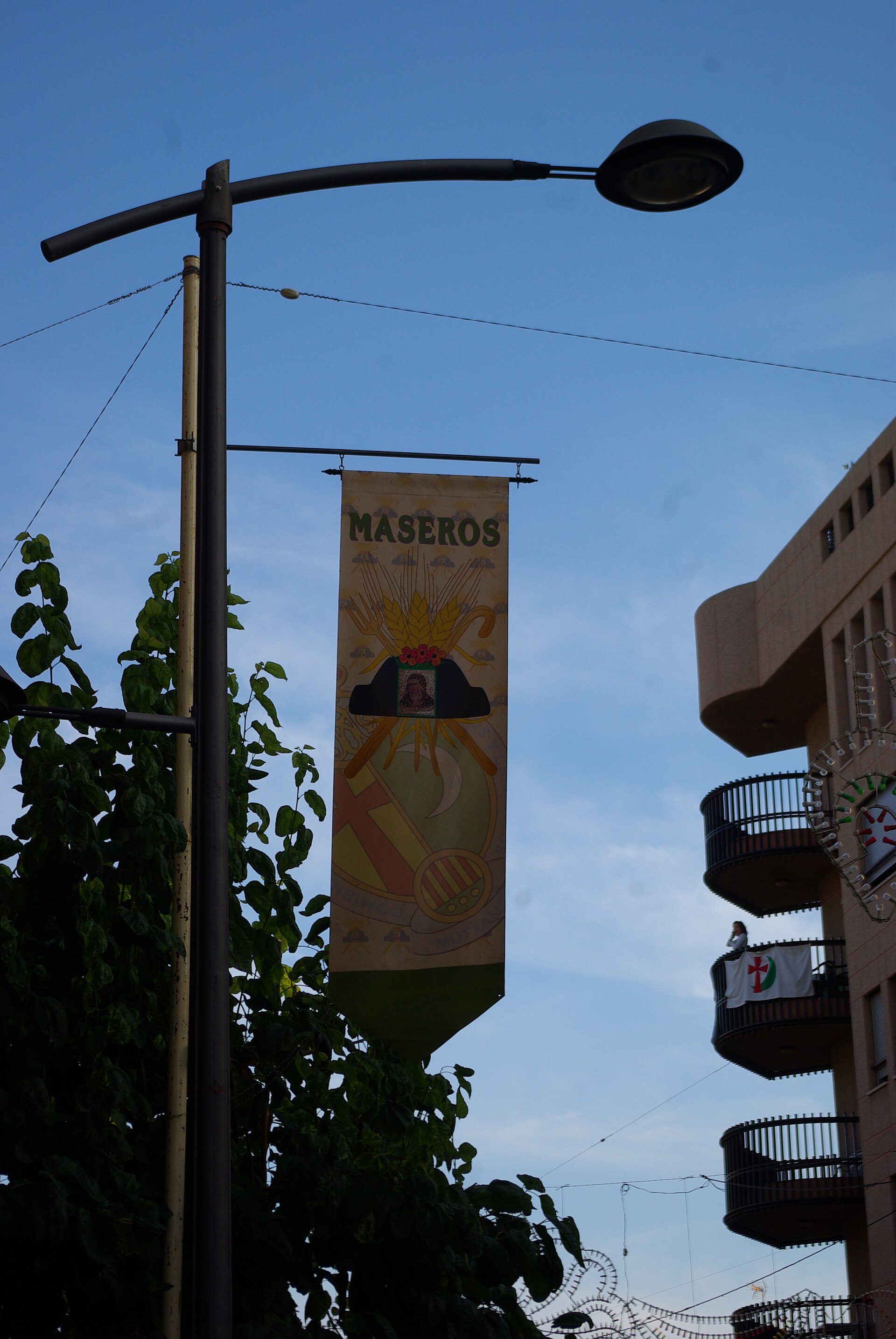 Alt text: Room with balcony, city view, modern decor, and large windows.