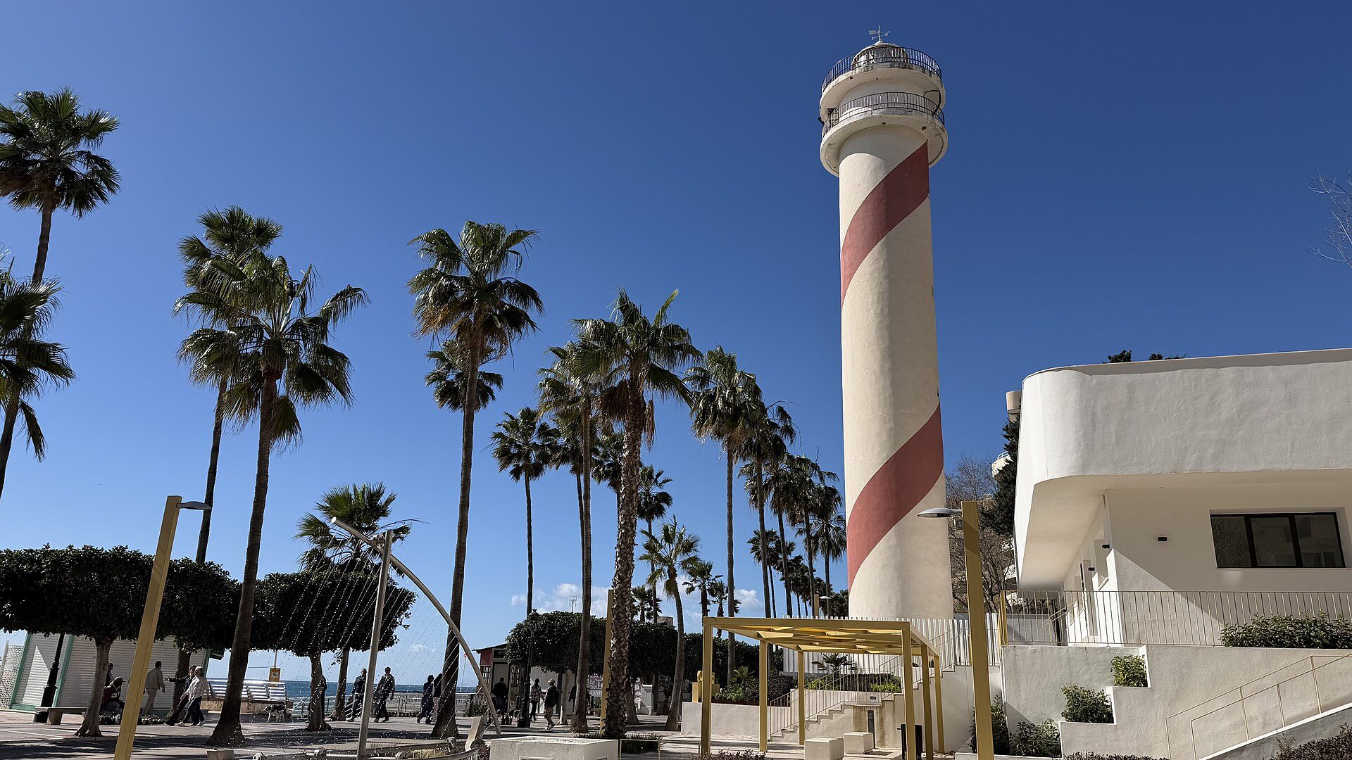 Alt text: "Cozy beachfront room with ocean view, balcony, and modern amenities.