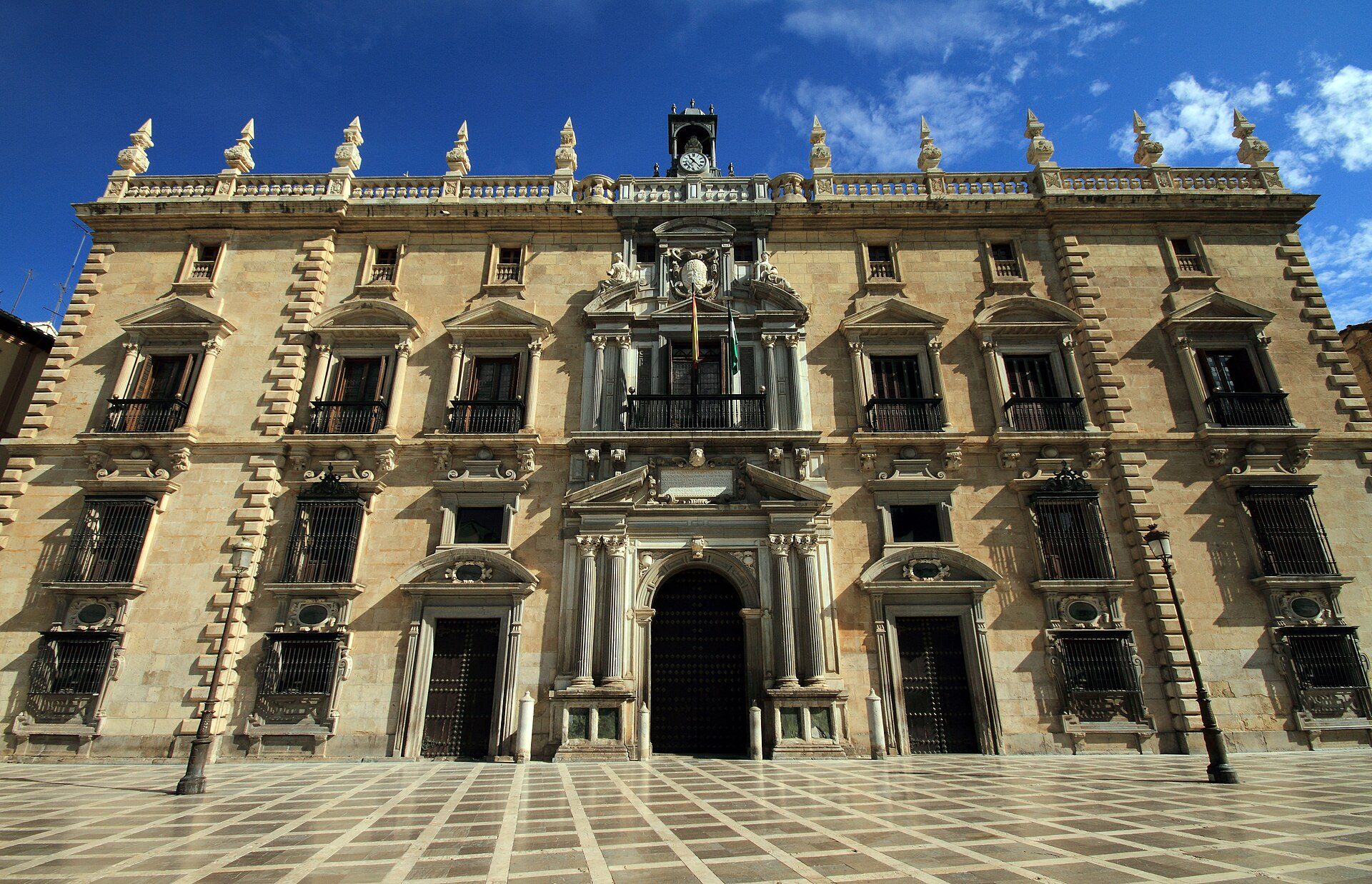 Alt text: Historic building with ornate facade, large windows, and central entrance.