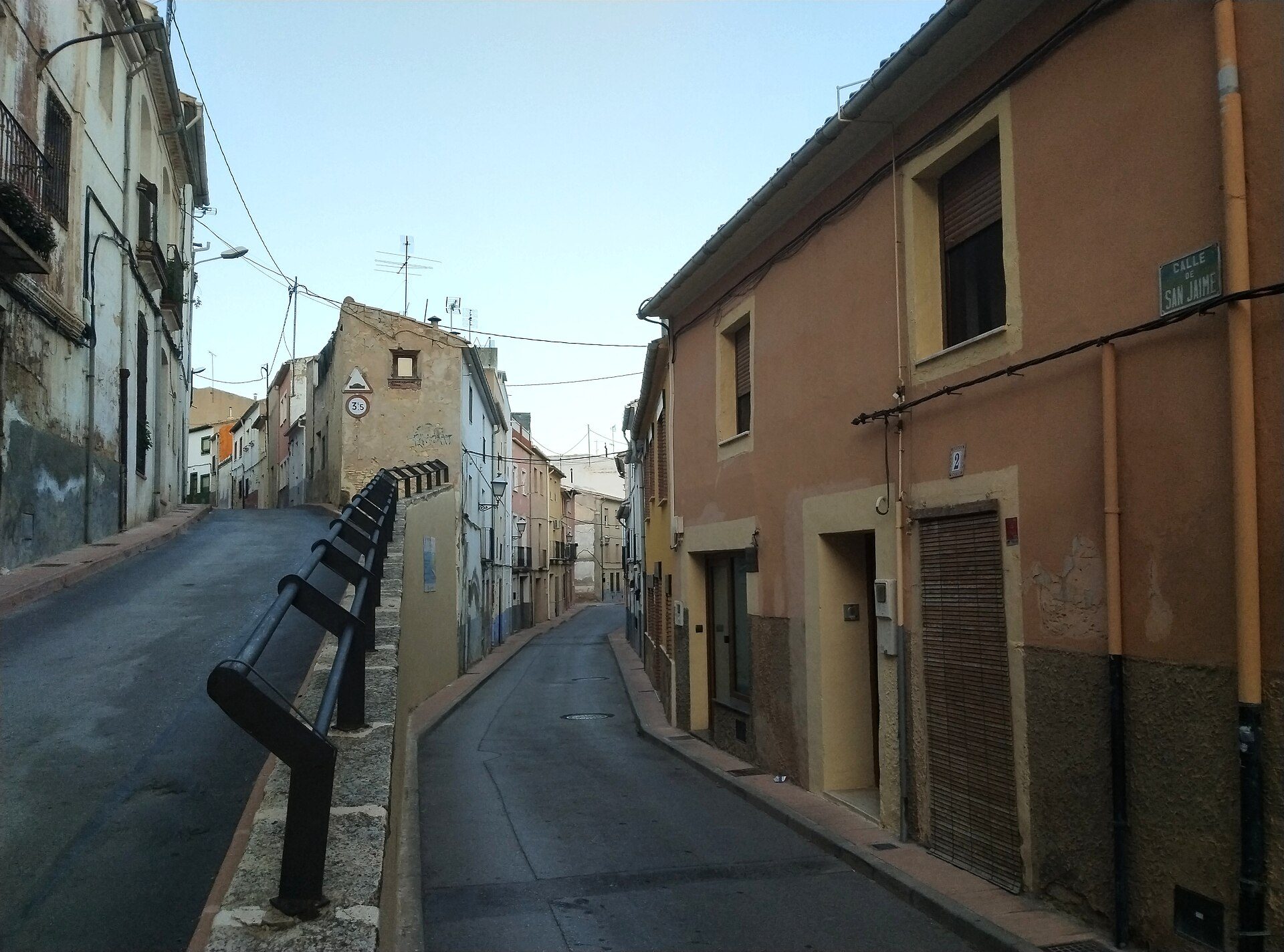 Cozy apartment with street view, featuring a balcony and modern amenities.