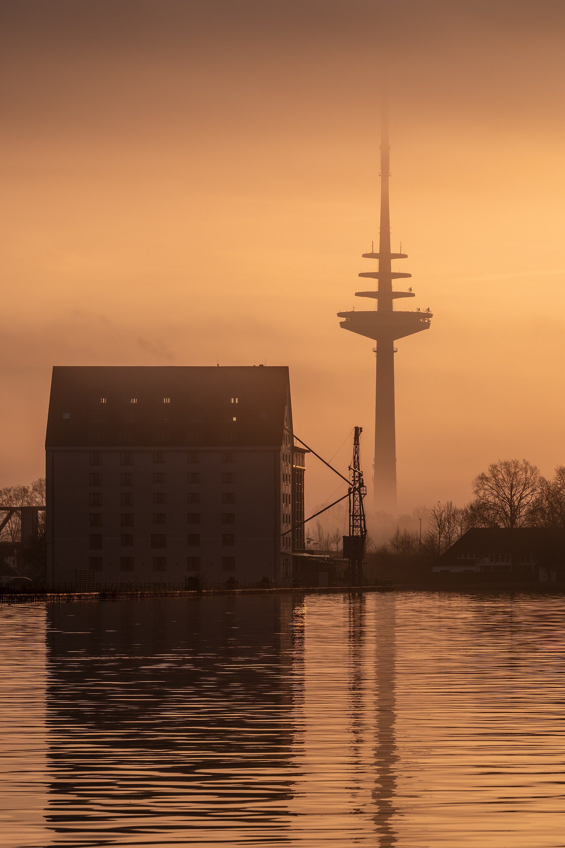 Alt text: "Room with waterfront view, large windows, and modern amenities.