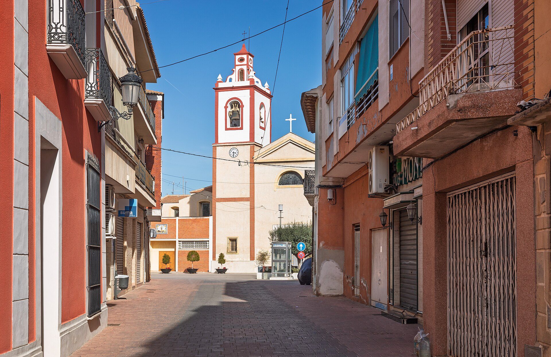 Alt text: Cozy apartment with city view, featuring a balcony and modern decor.