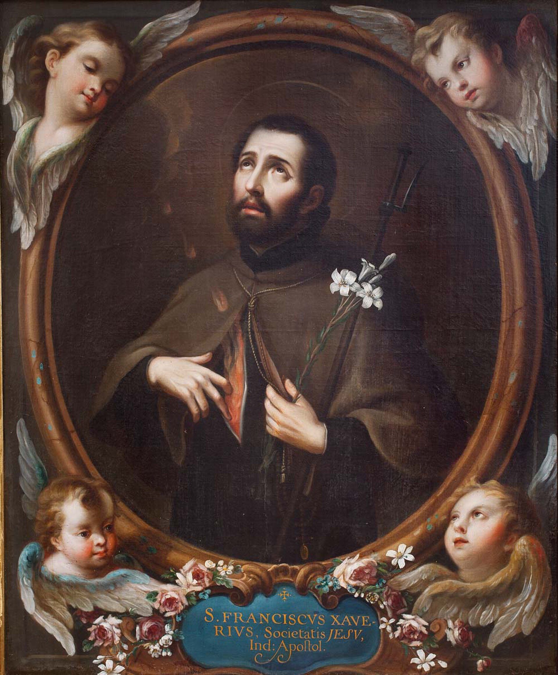 Alt text: A framed painting of St. Francis Xavier holding a lily, surrounded by angels.