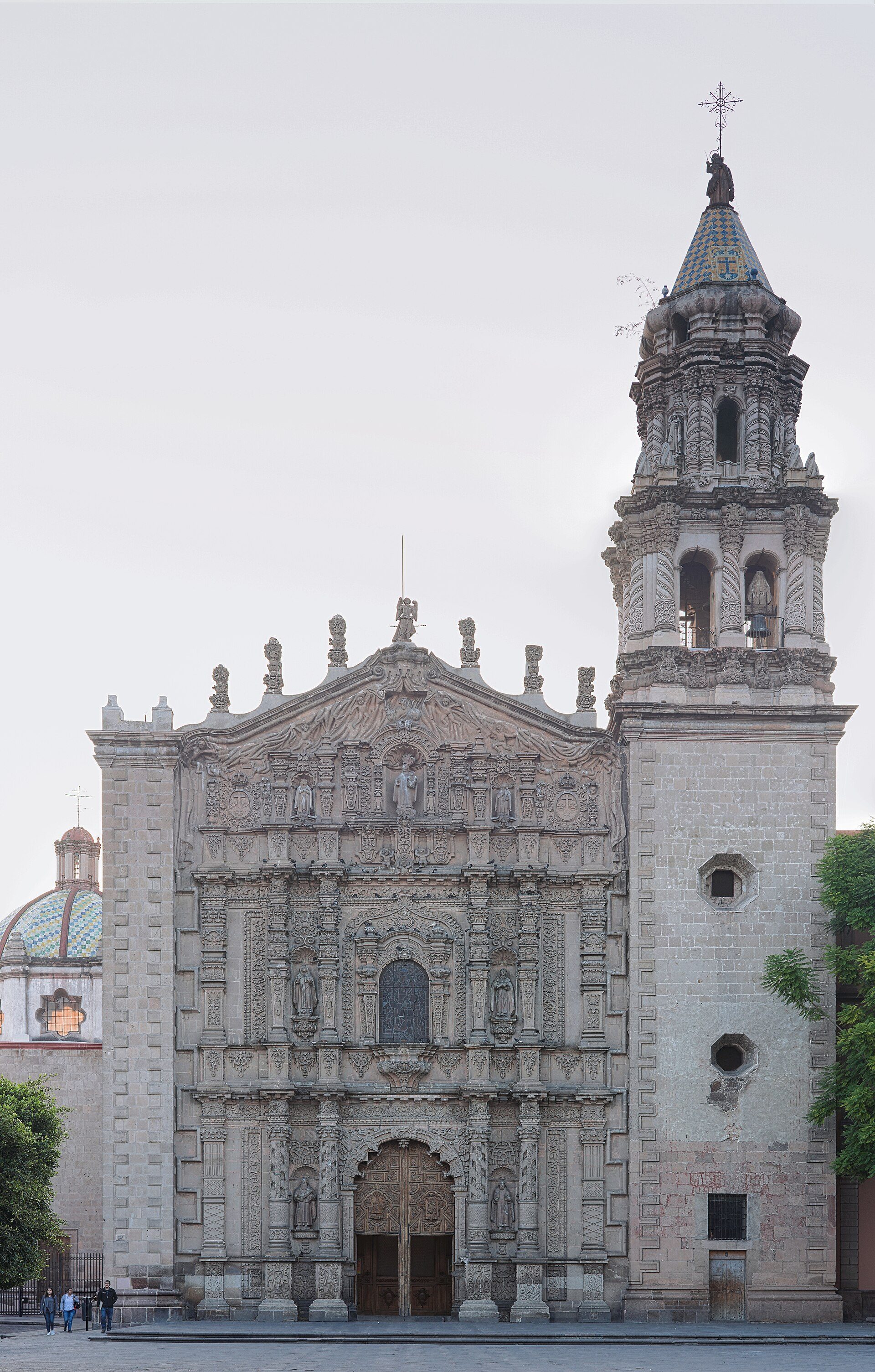 Alt text: Historic church with ornate facade, bell tower, and dome.