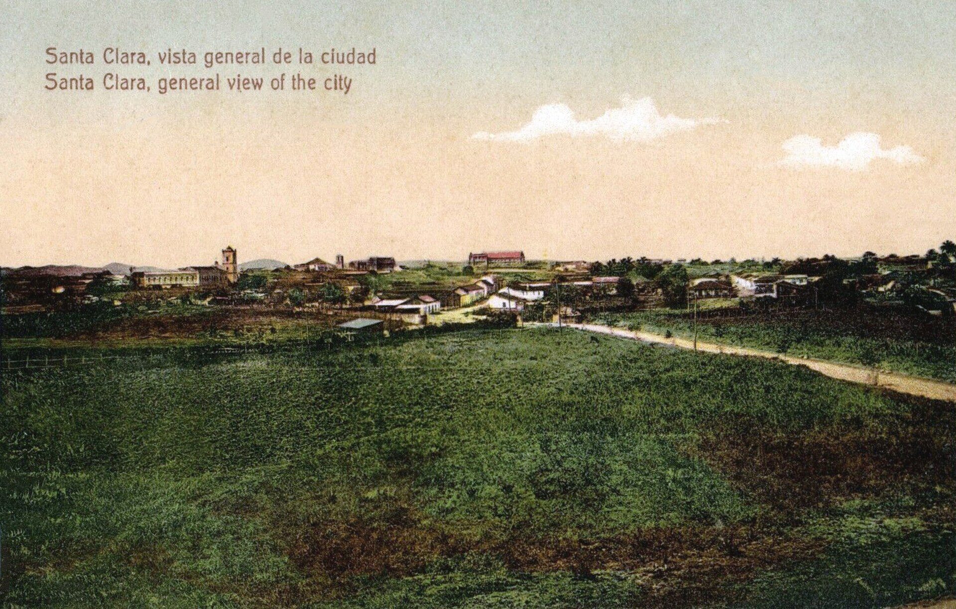 Alt text: Panoramic view of Santa Clara cityscape with green fields and historic buildings.
