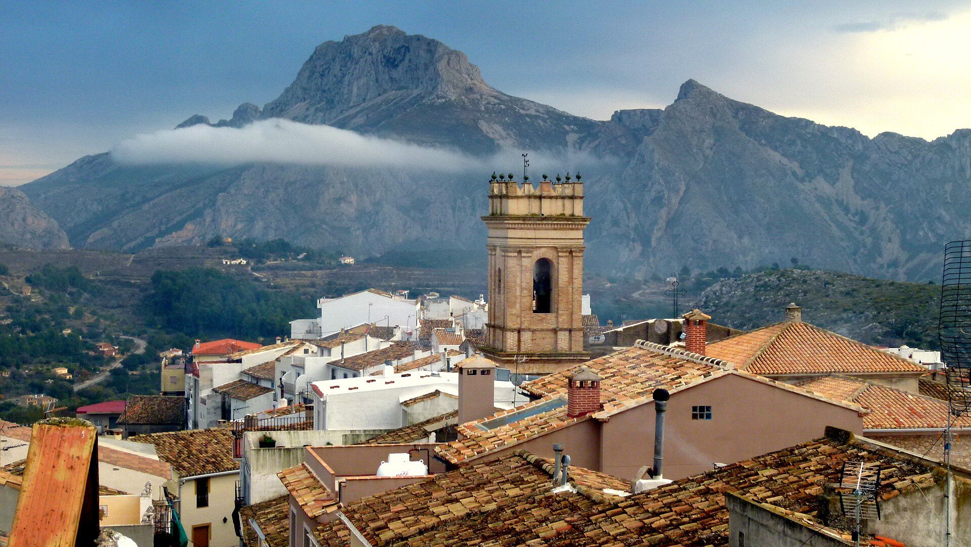 Cozy room with mountain view, featuring a balcony and rustic decor.