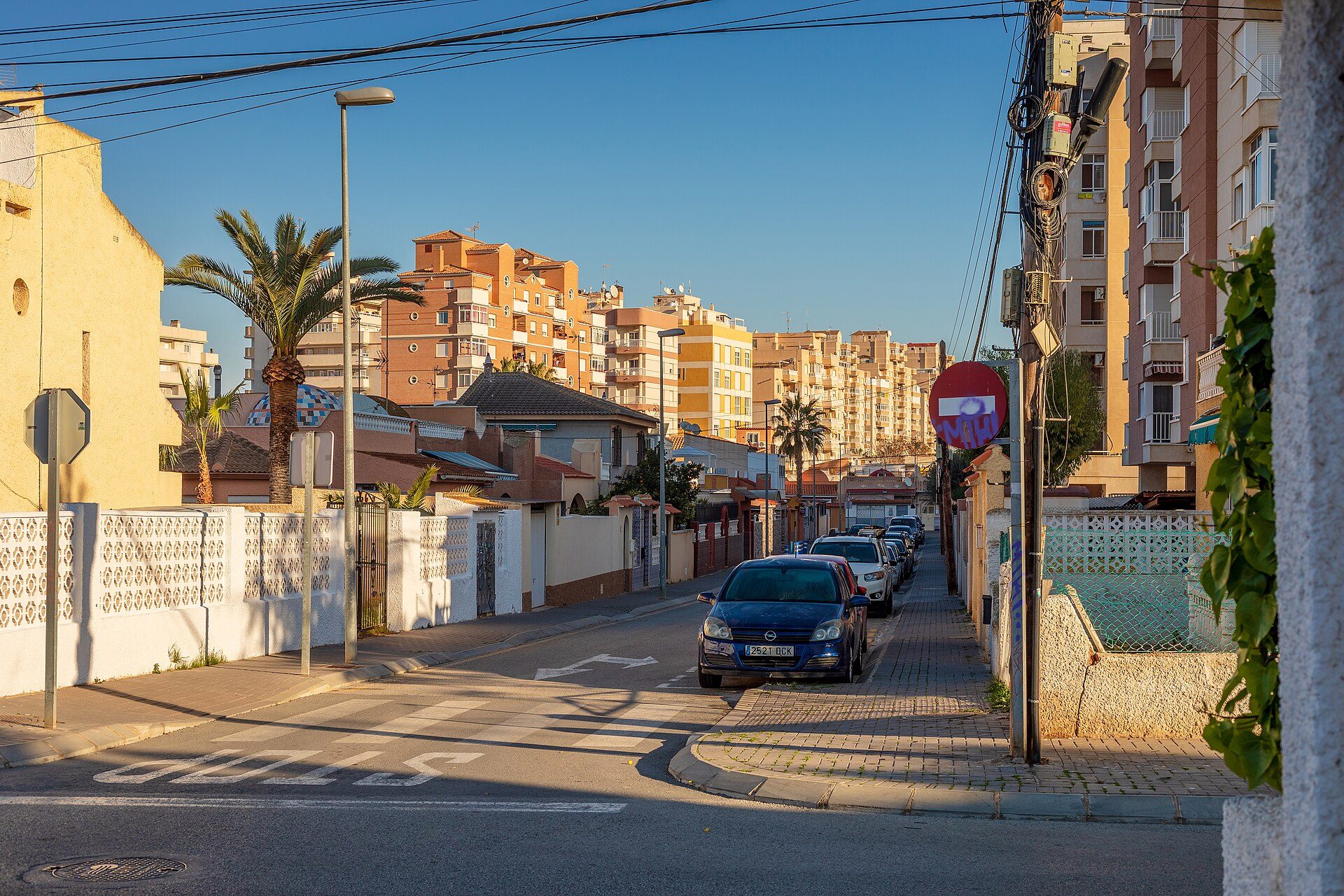 A cozy apartment with a city view, featuring a balcony and modern decor.