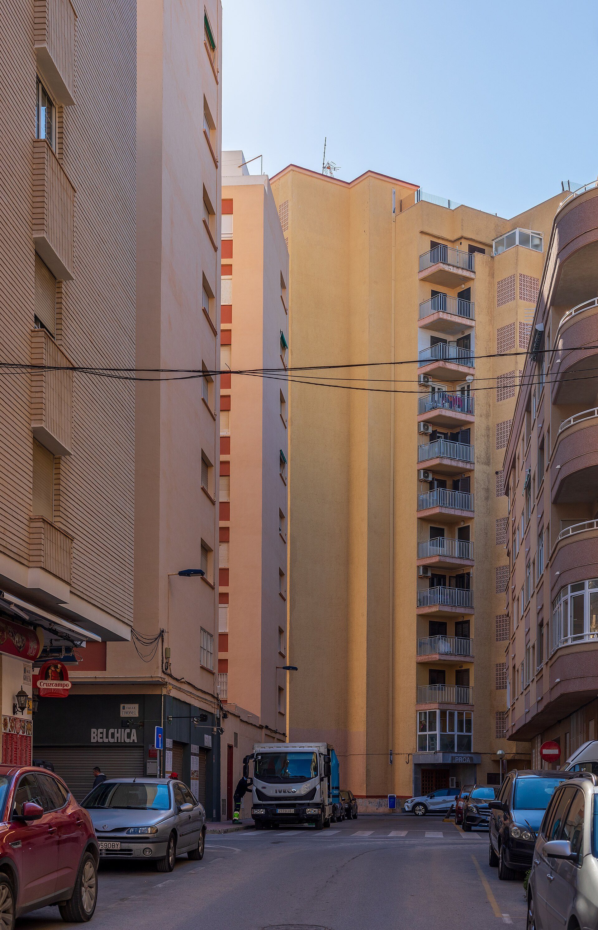 A spacious apartment with a city view, featuring a balcony and modern amenities.