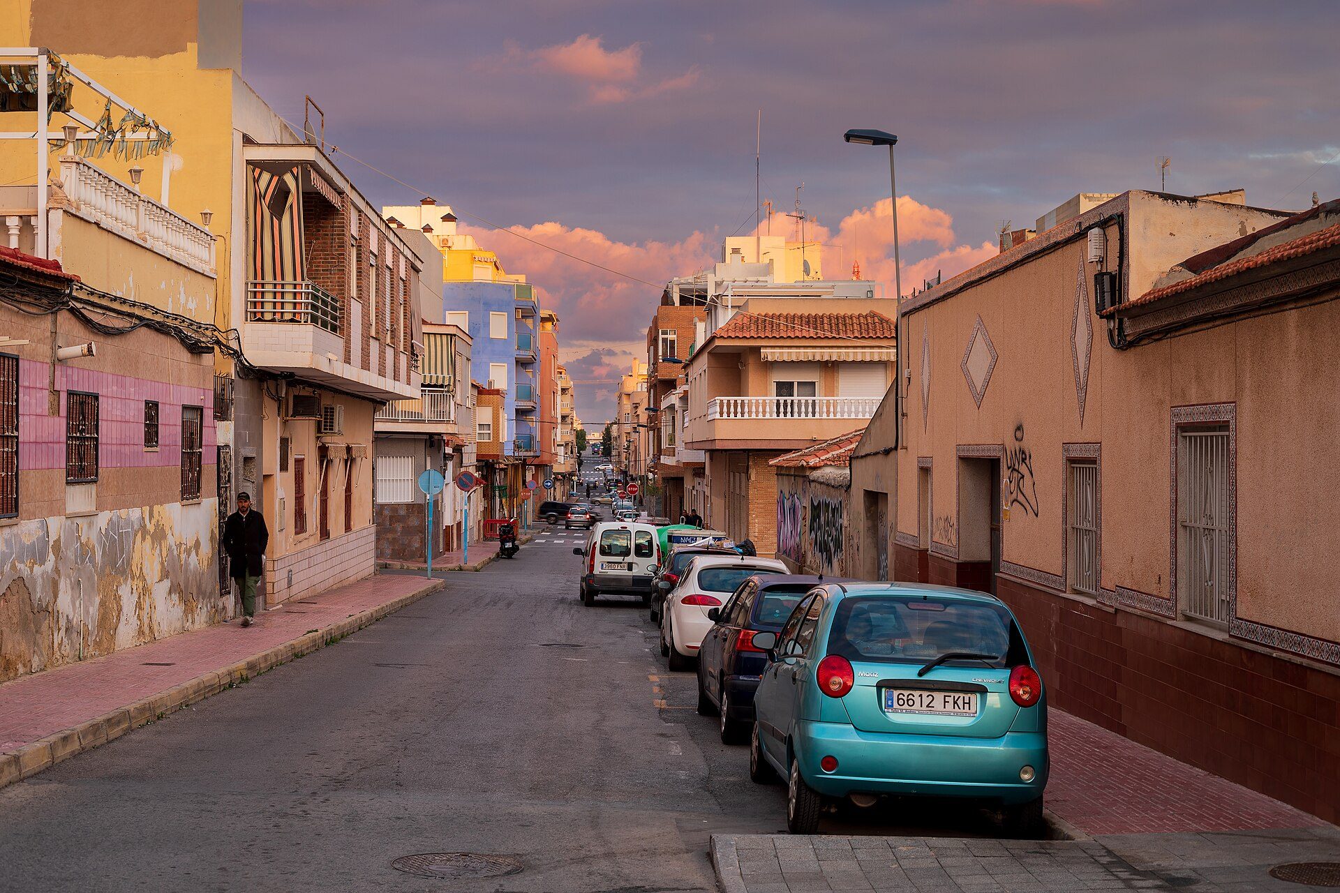 Cozy apartment with city view, featuring a balcony and modern decor.