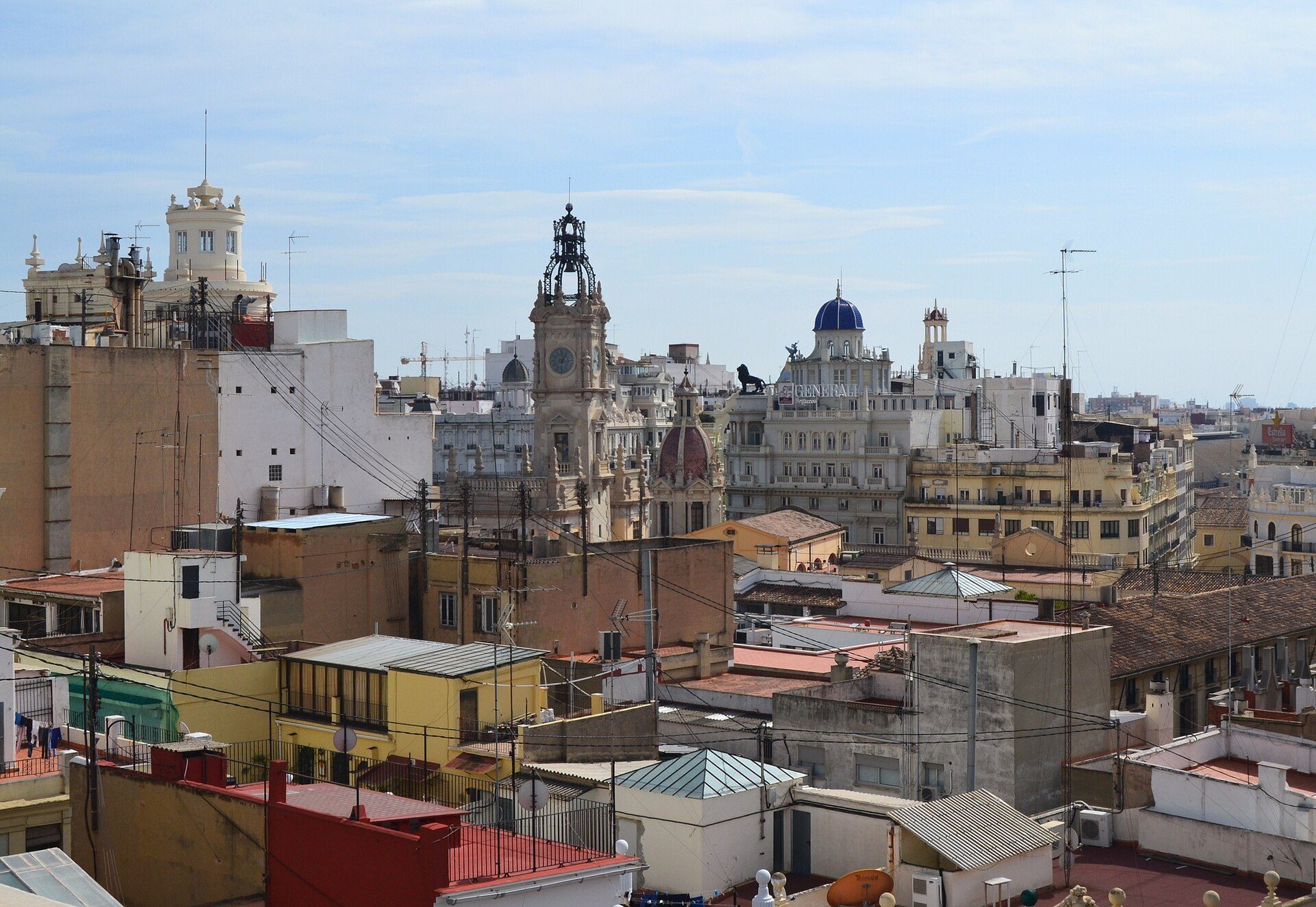 Alt text: Spacious room with cityscape view, featuring a balcony and modern amenities.