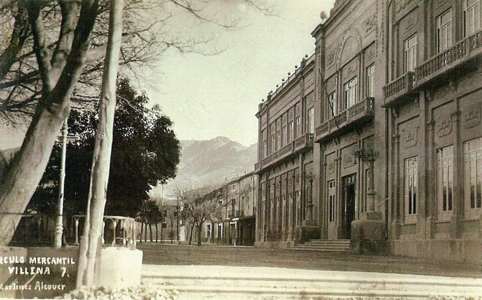 Alt text: Classic hotel room with mountain view, balcony, and elegant decor.