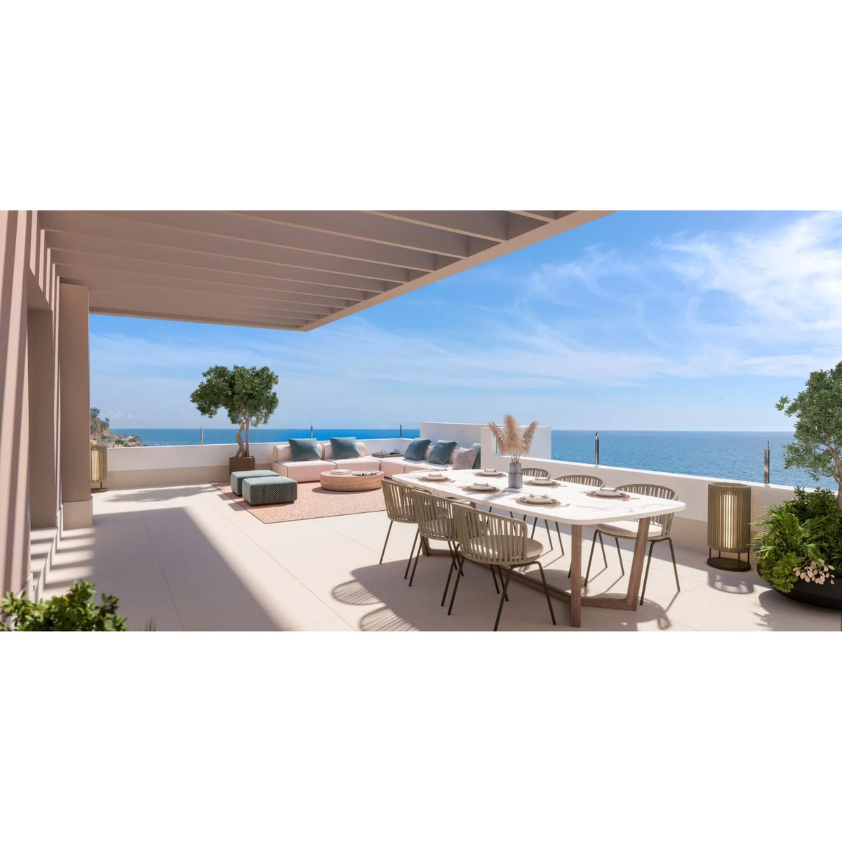 Luxe terras met oceaanzicht, eettafel en loungegedeelte.